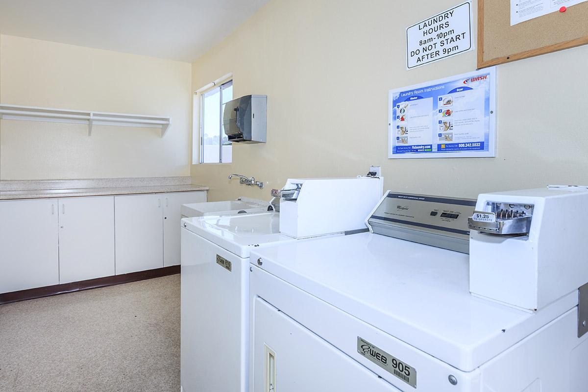 a white refrigerator freezer sitting inside of a kitchen