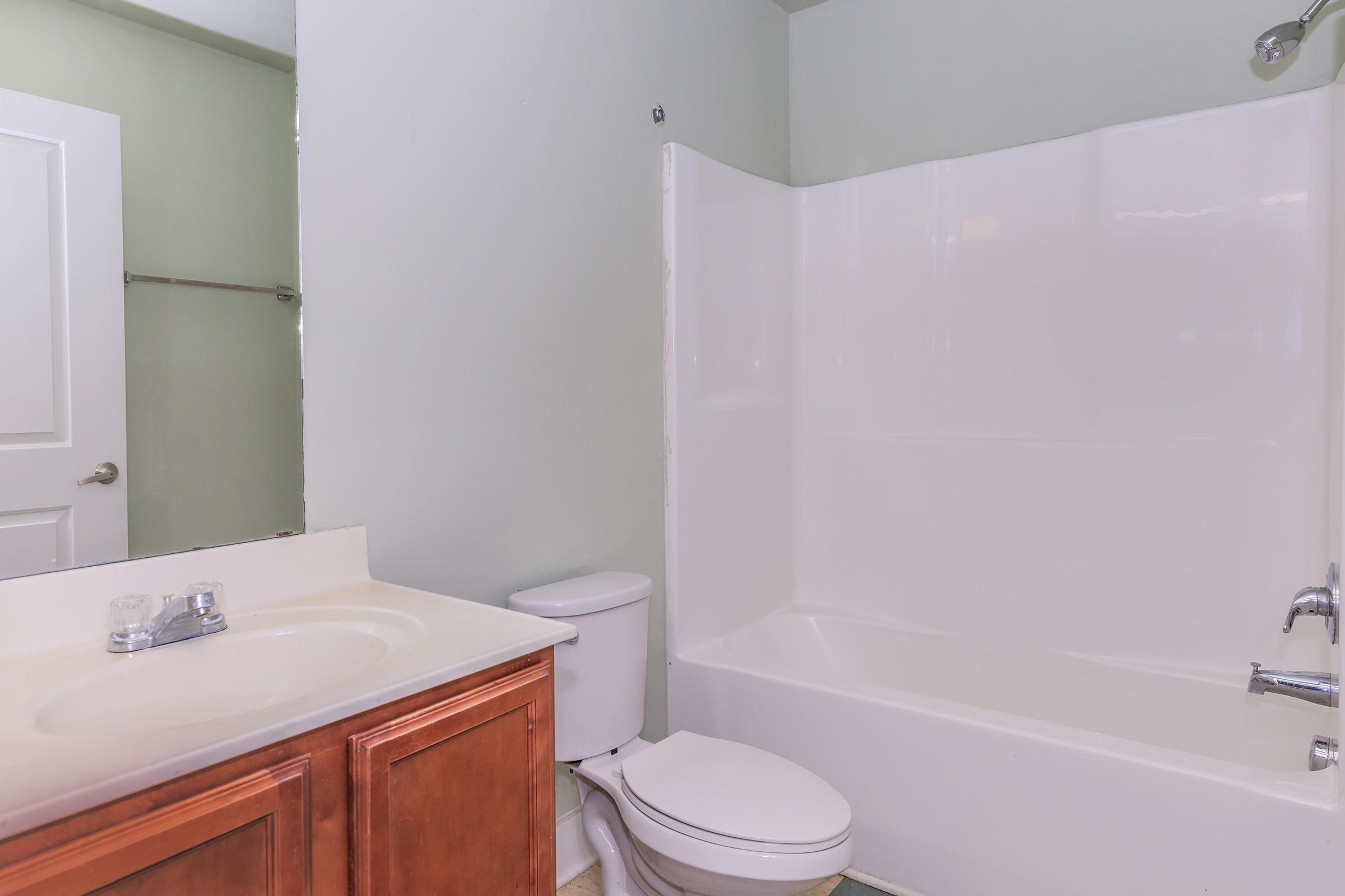 a room with a sink and a bath tub