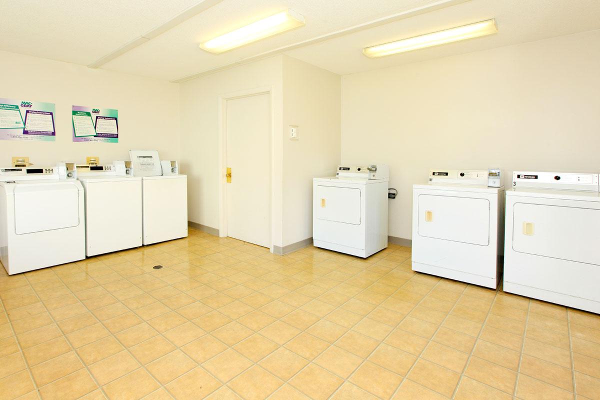 a large white refrigerator in a kitchen