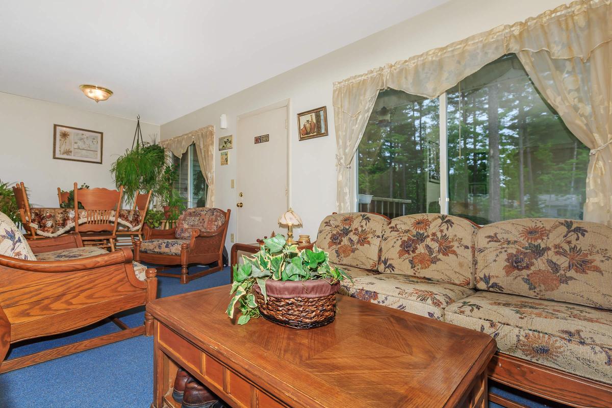 a living room filled with furniture and a fireplace