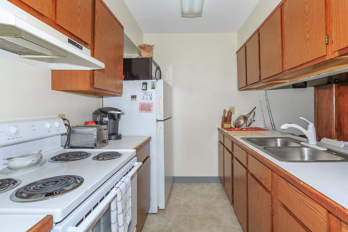 a kitchen with a stove top oven sitting inside of a refrigerator