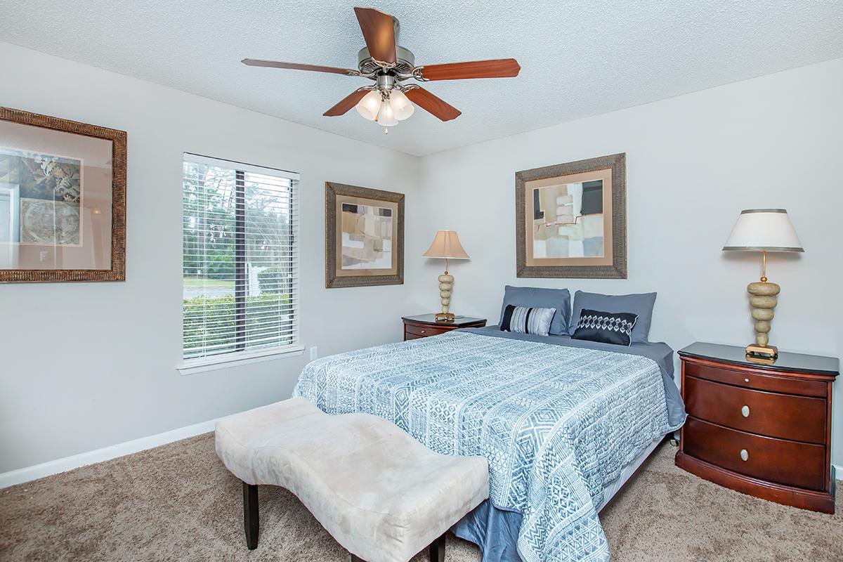 a bedroom with a large bed in a room