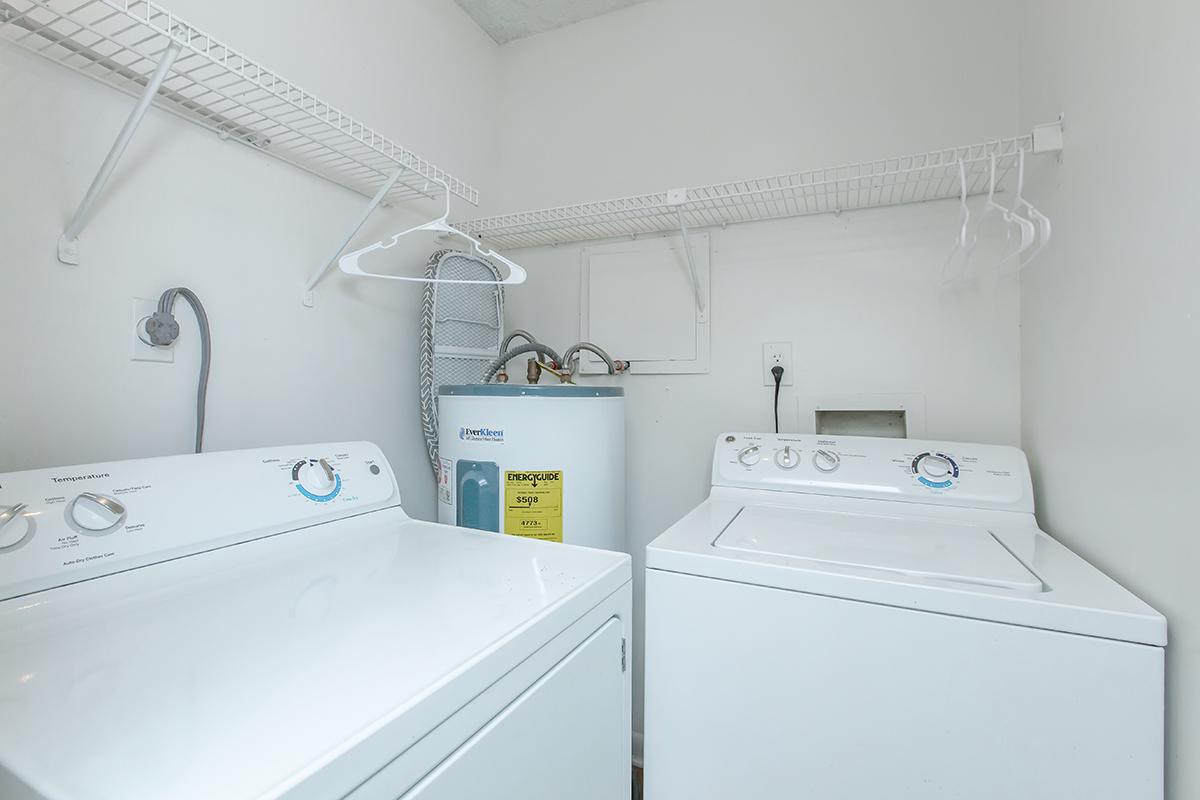 a white refrigerator freezer sitting next to a sink