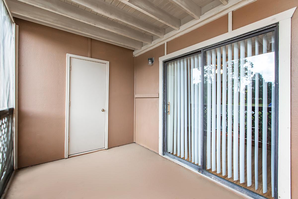 a bedroom with a building in the background