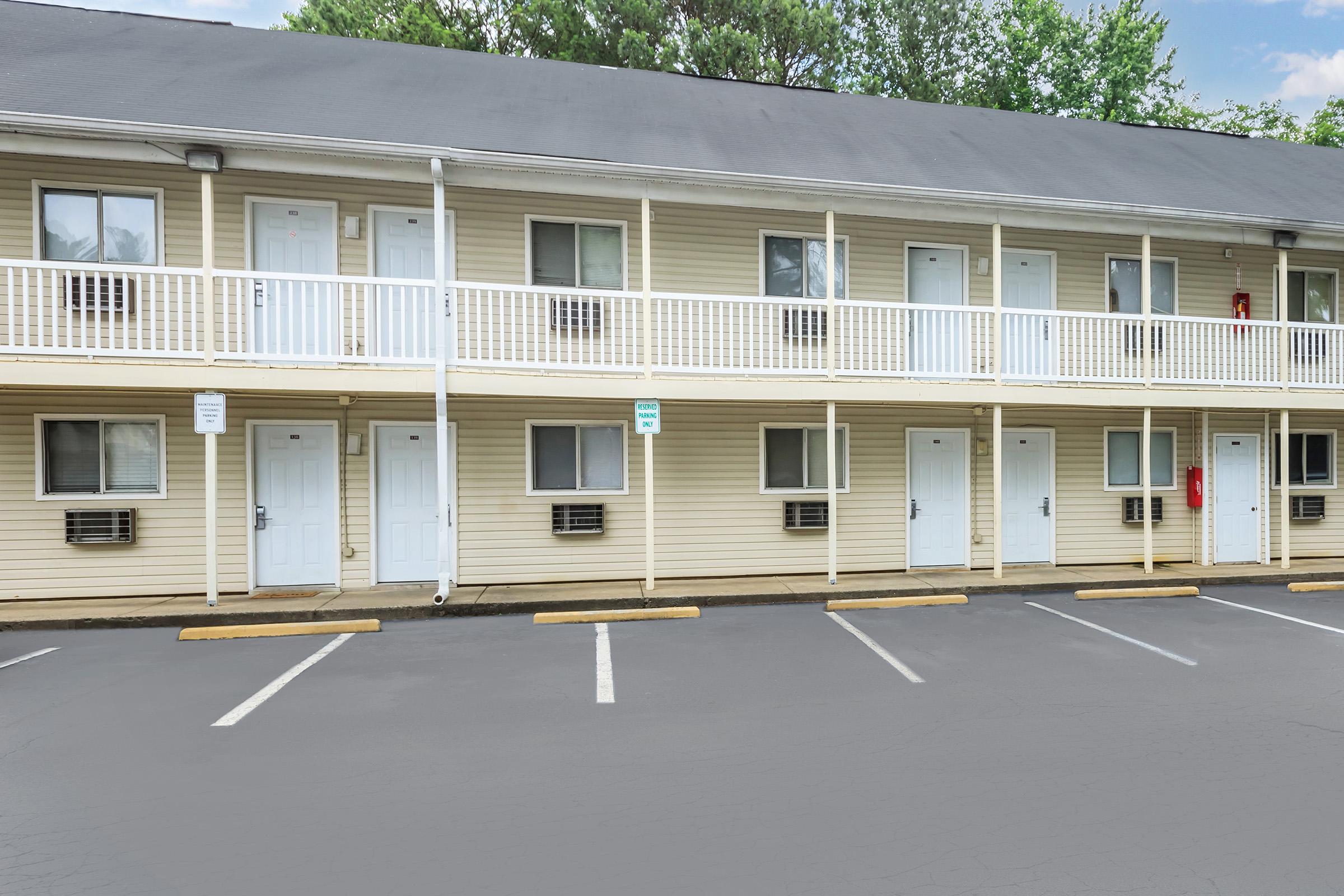 a large empty parking lot in front of a building