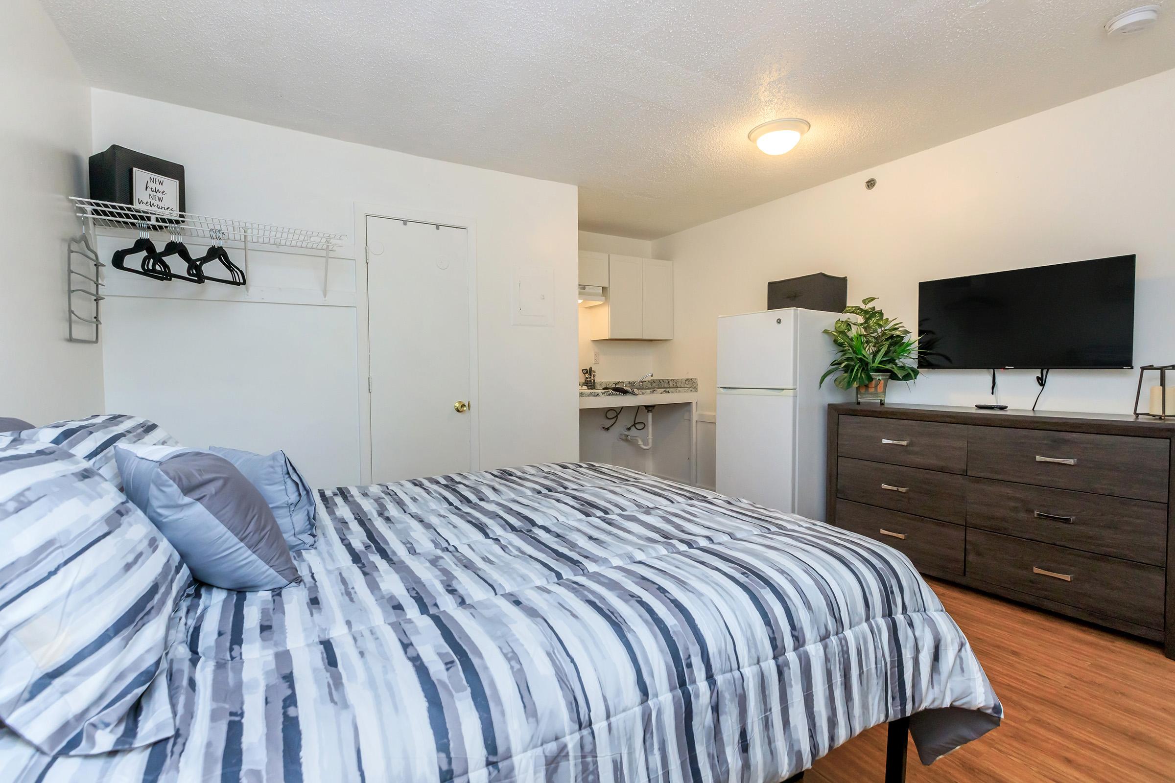 a bedroom with a large bed in a room