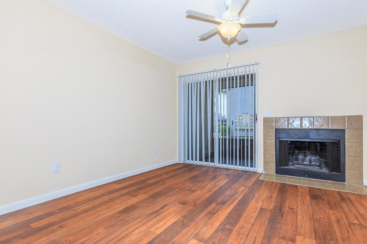 a living room filled with furniture and a fireplace