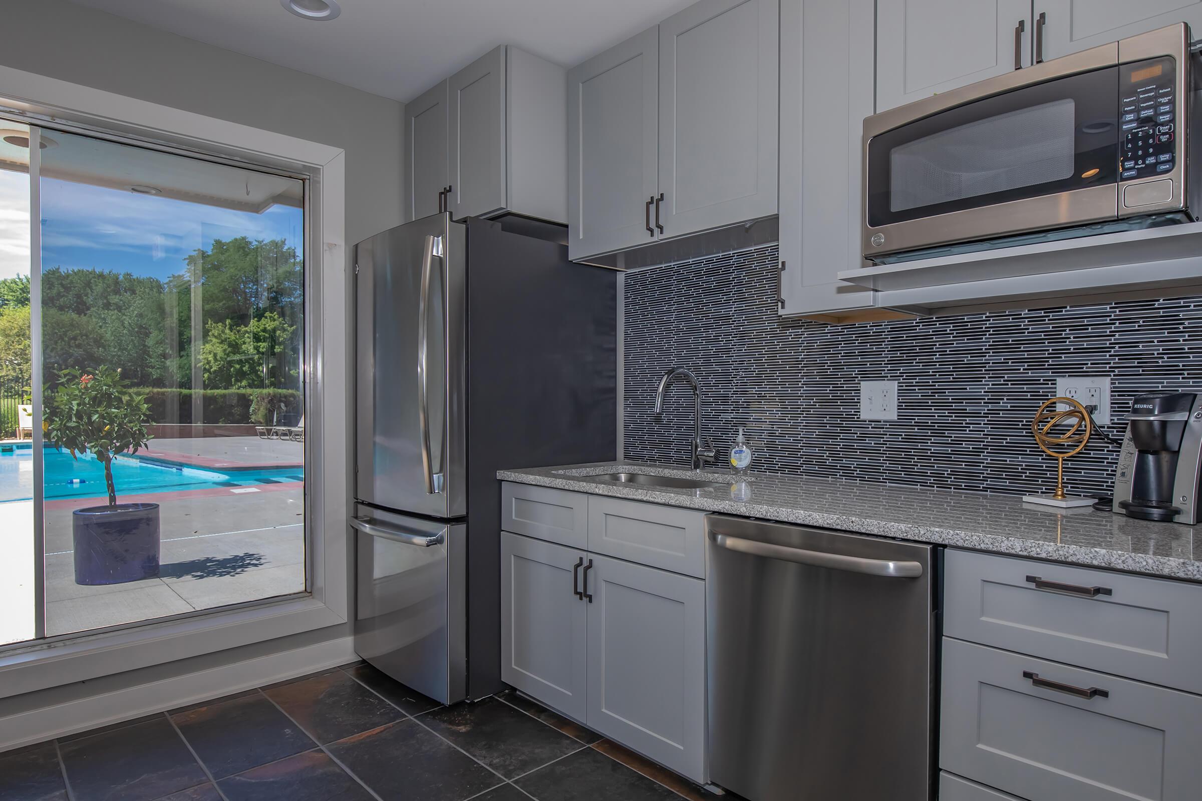 a large kitchen with stainless steel appliances