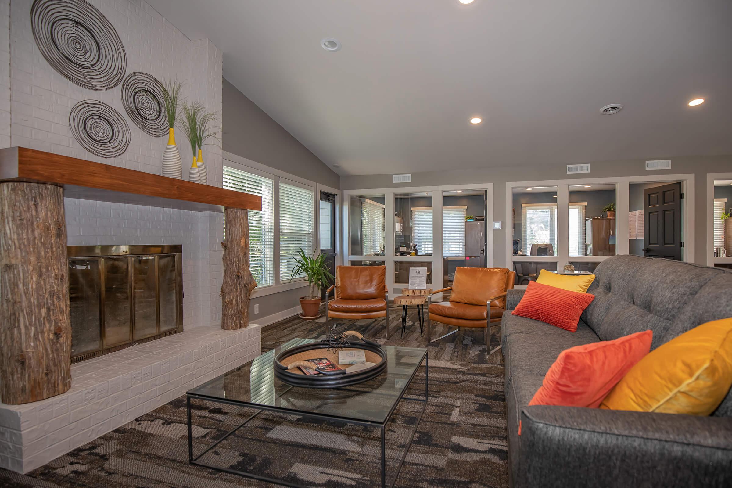 a living room filled with furniture and a fireplace