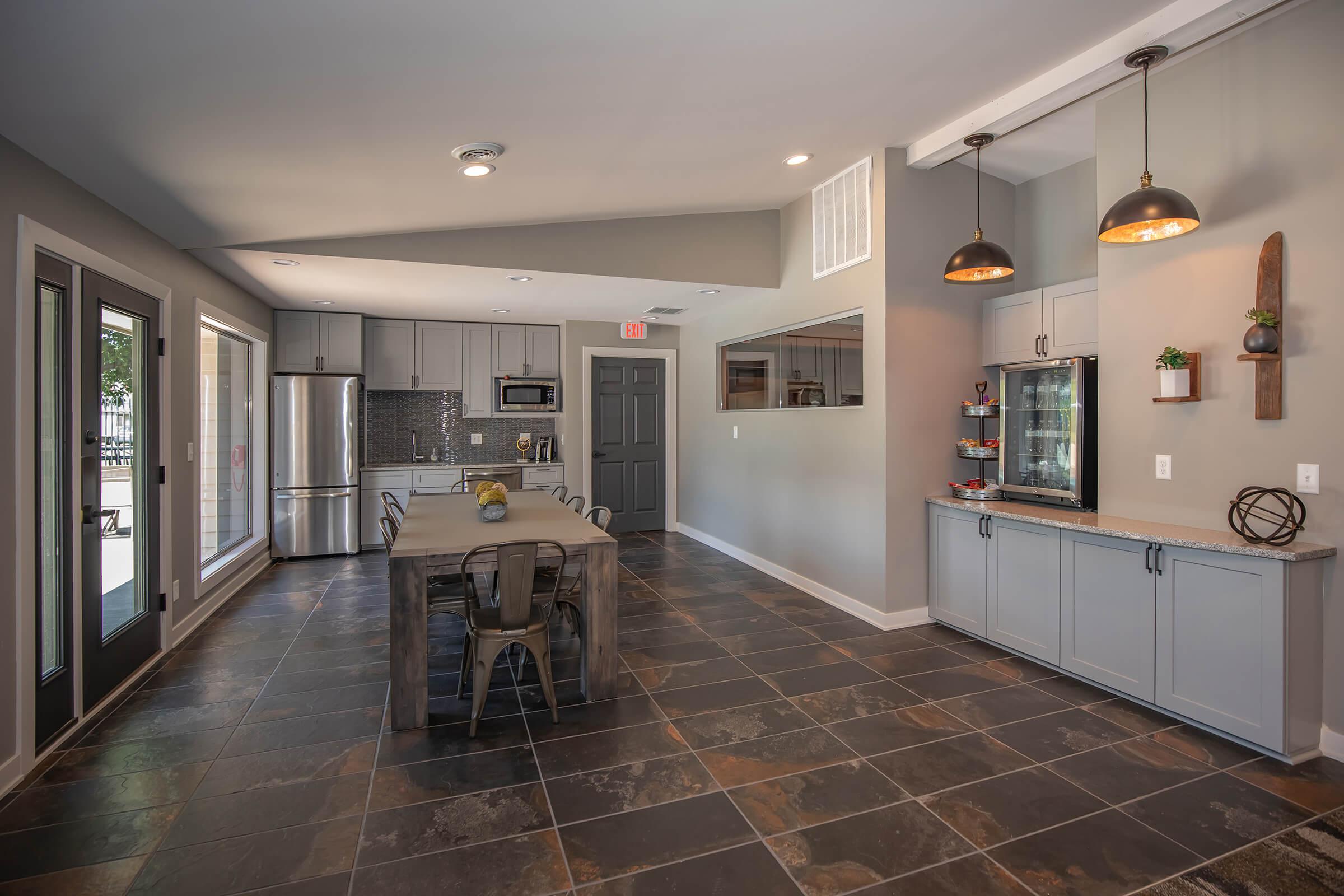 a large kitchen with stainless steel appliances