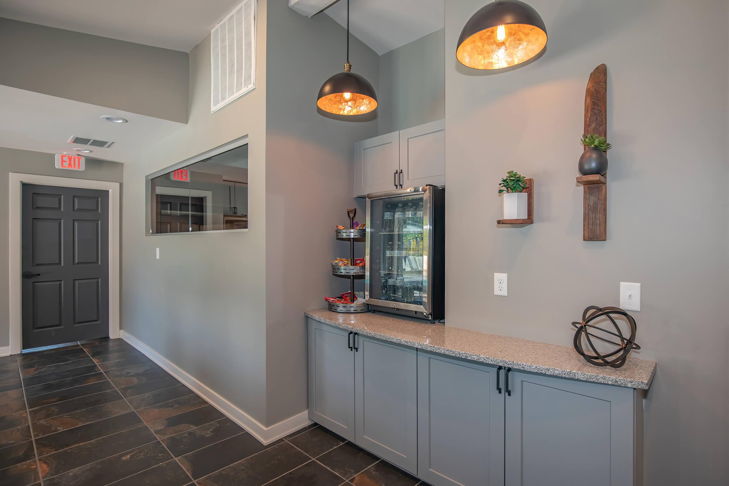 a kitchen area with a building in the background