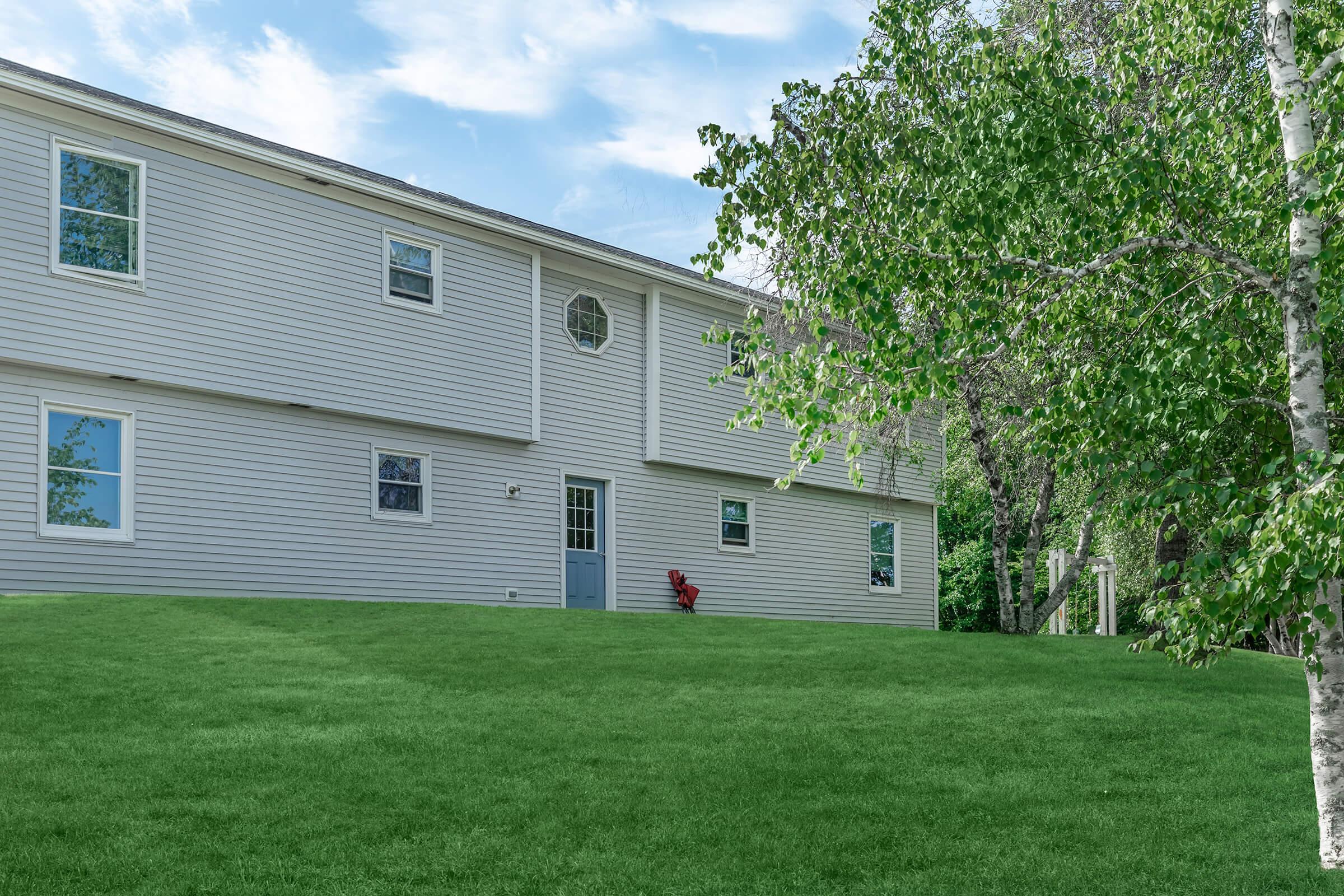 a large lawn in front of a house