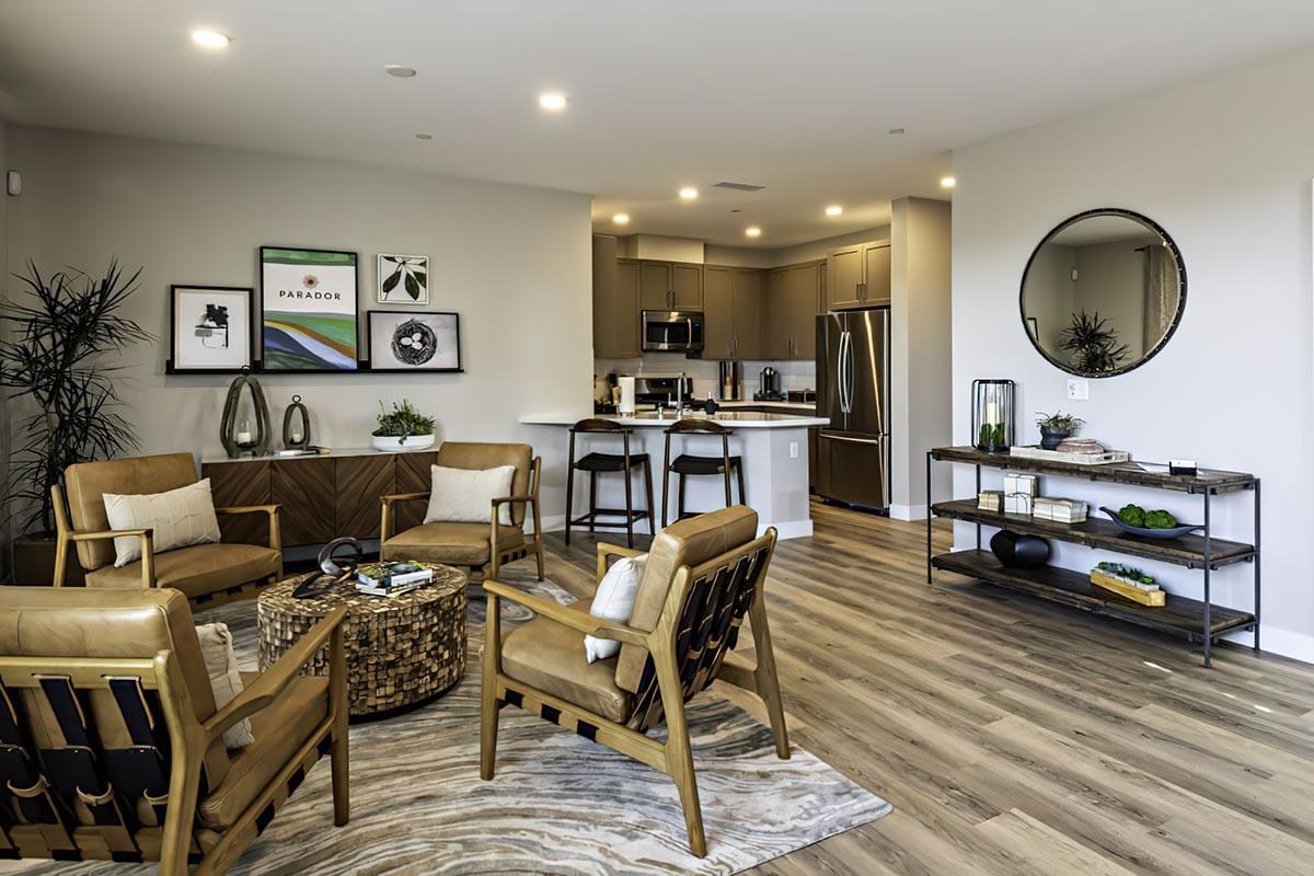 Apartments Near Fresno State - Parador Townhomes - Modern Living Room Featuring Designer Flooring, Upgraded Appliances, And Chic Furniture