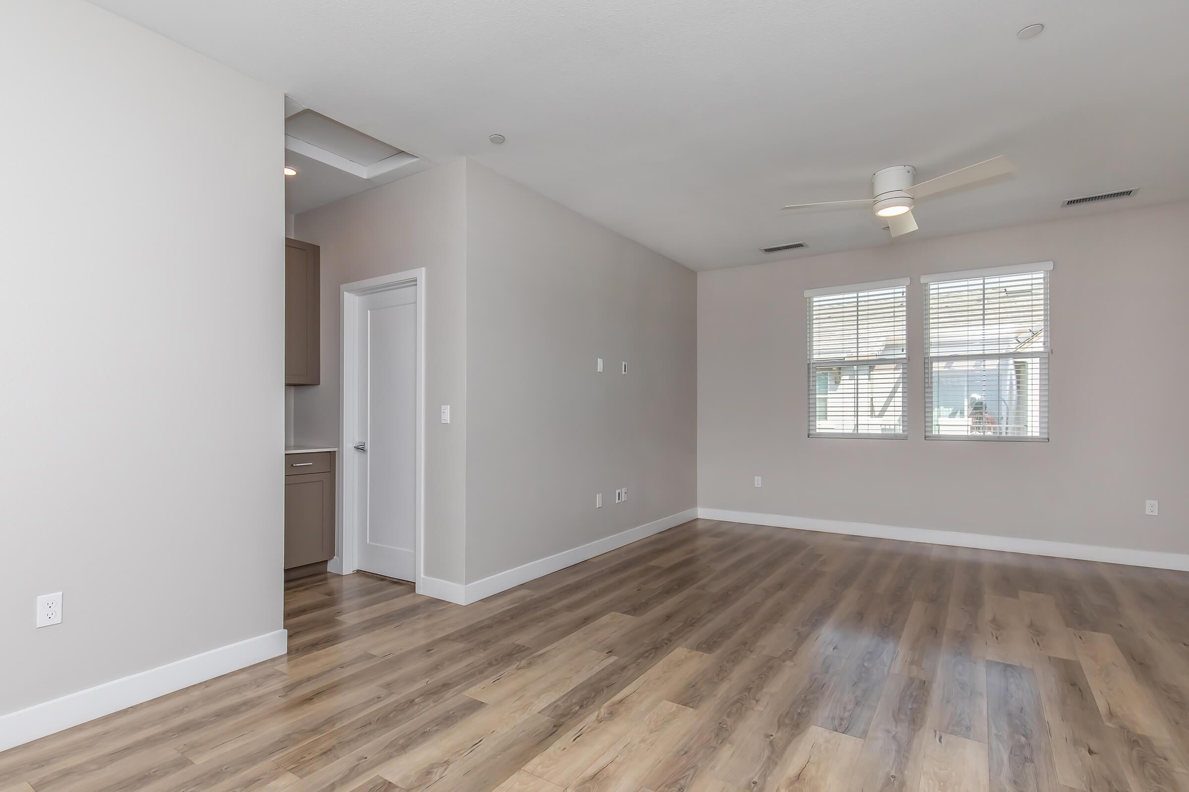 a large empty room with a wood floor