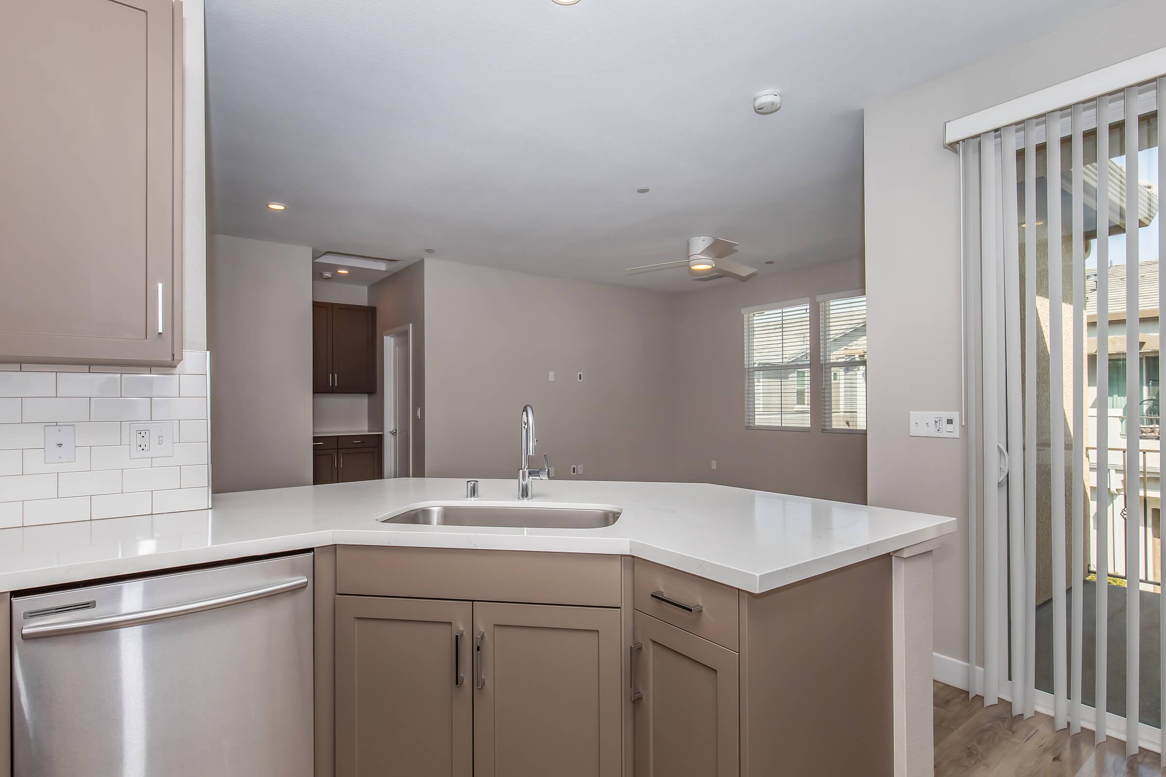 a kitchen with a sink and a window