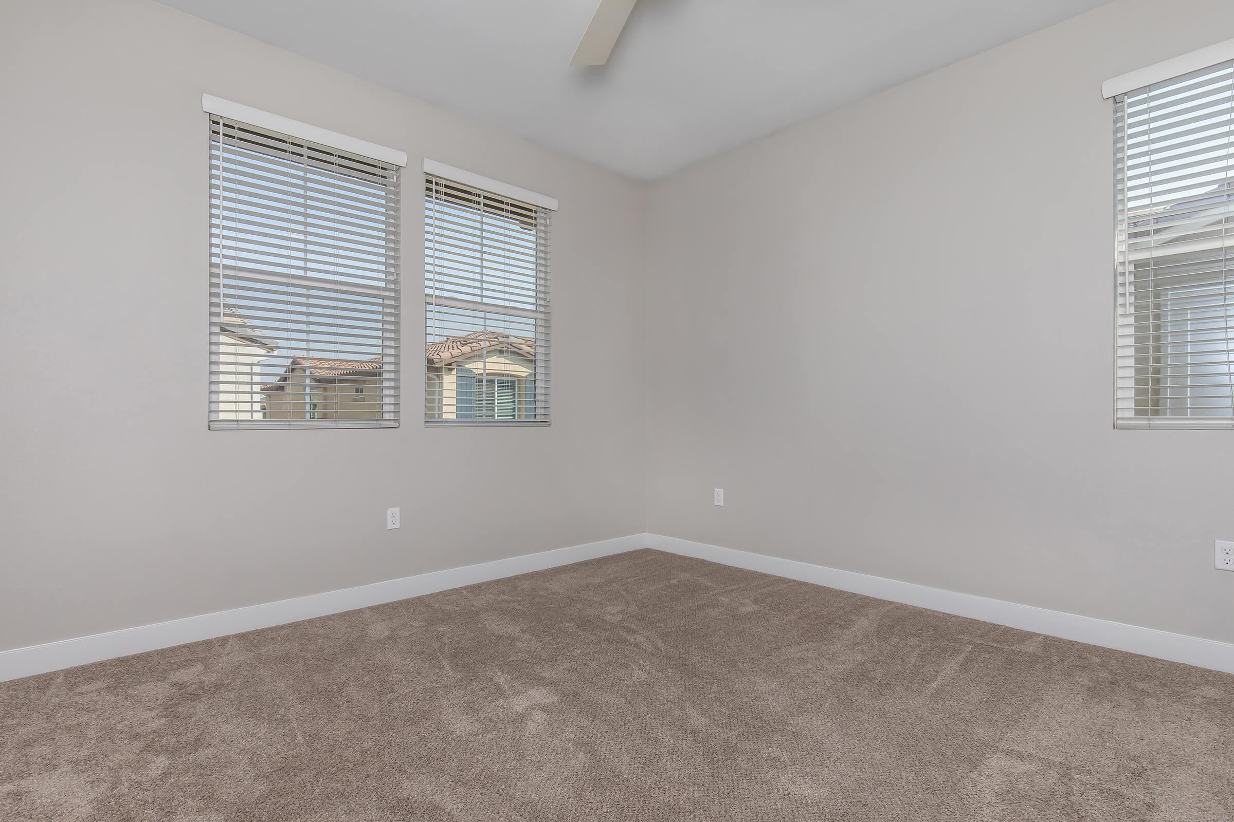 a bedroom with a large window