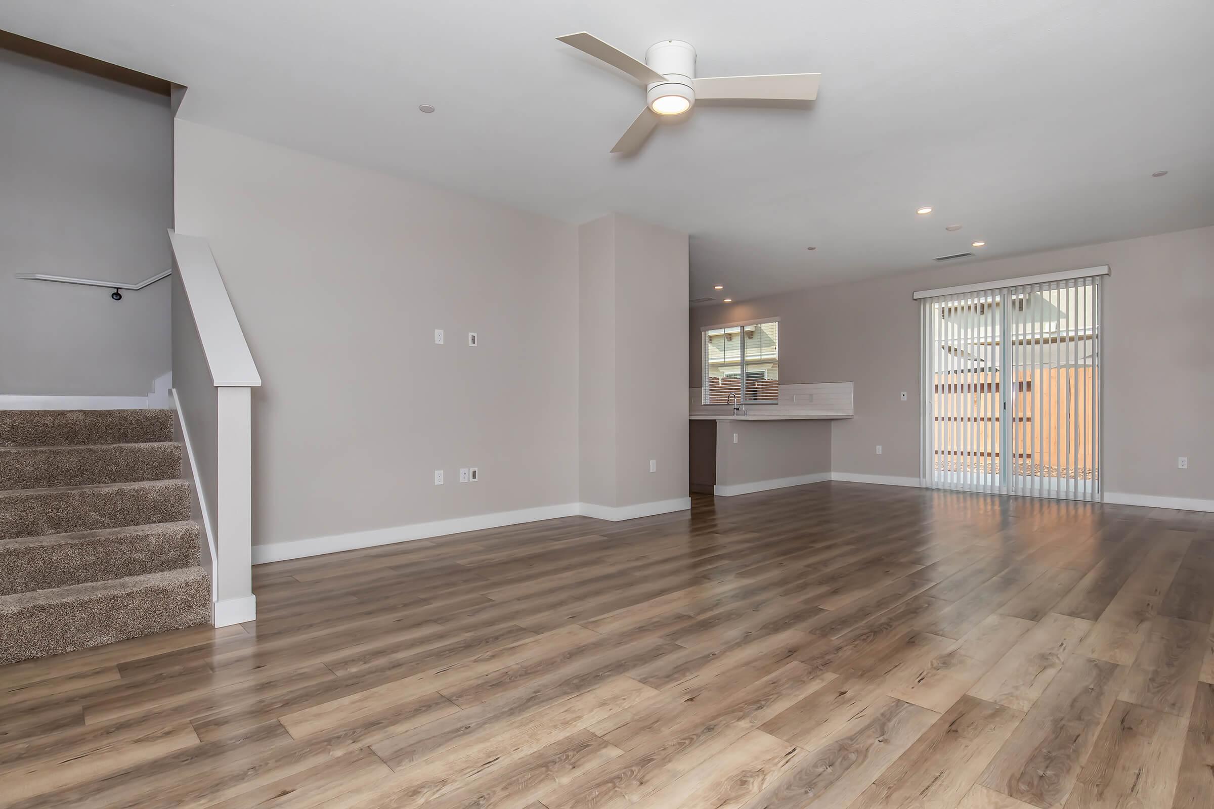 a large empty room with a wooden floor