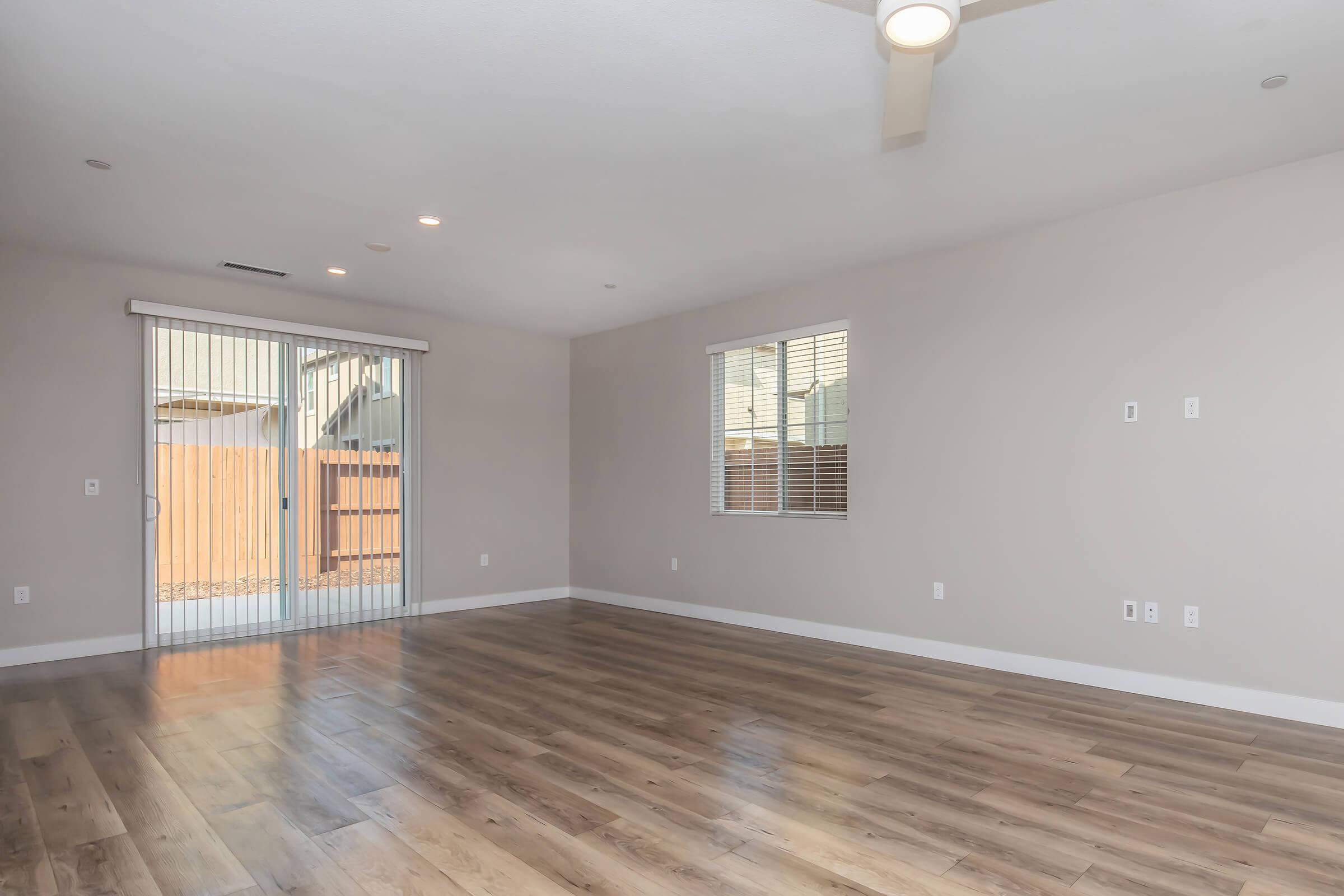 a large empty room with a wood floor