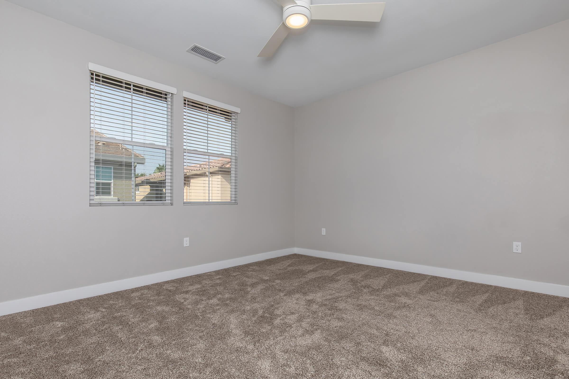 a bedroom with a large window