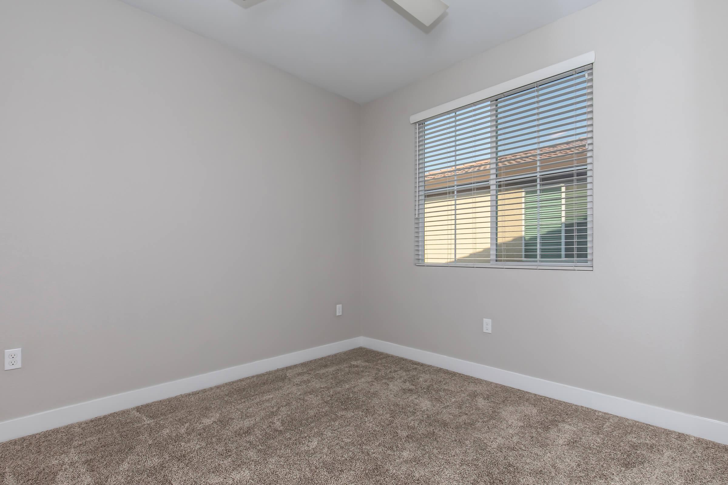 a bedroom with a large window