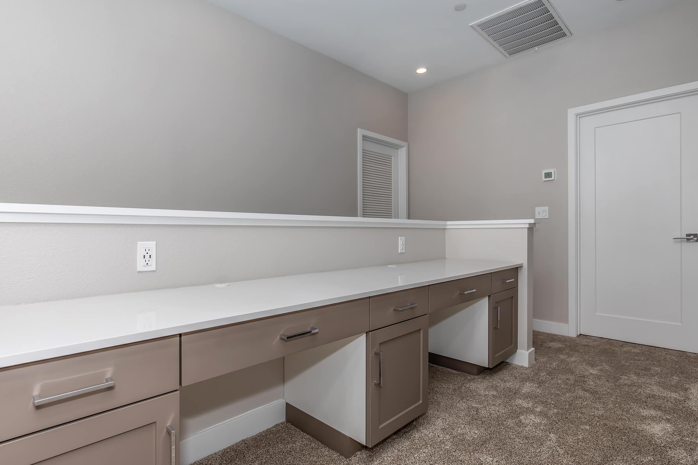 a kitchen with a sink and a mirror