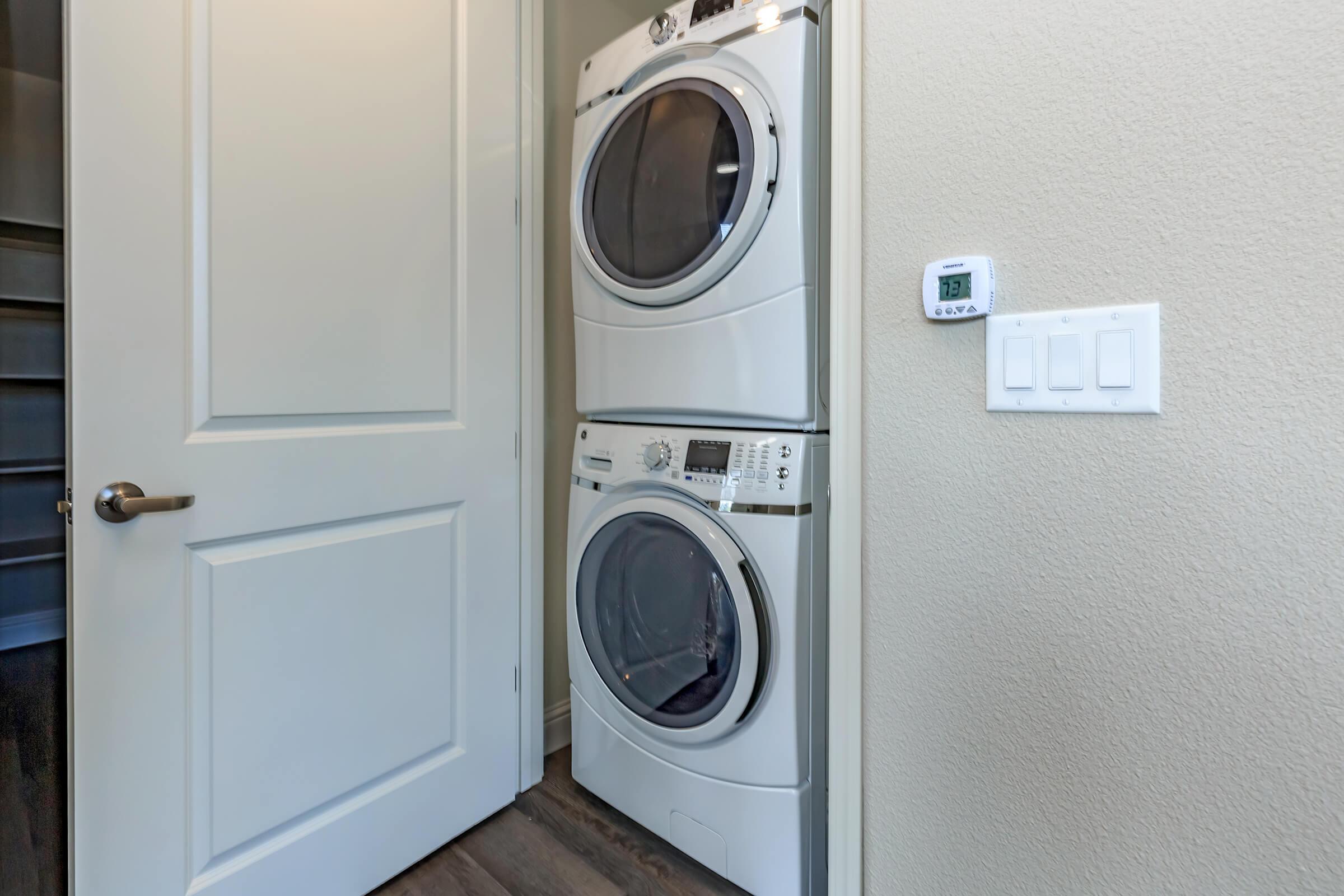 a washer and dryer next to a door