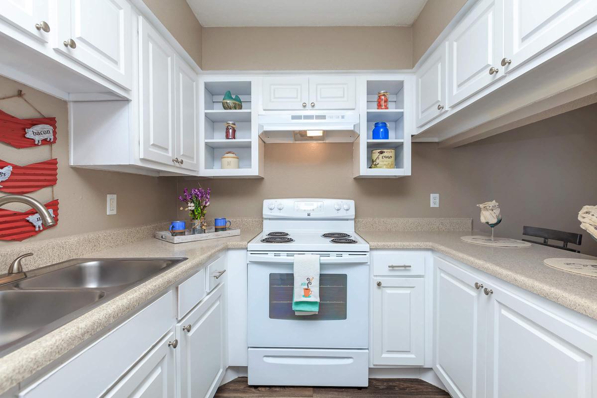 a kitchen with a sink and a microwave