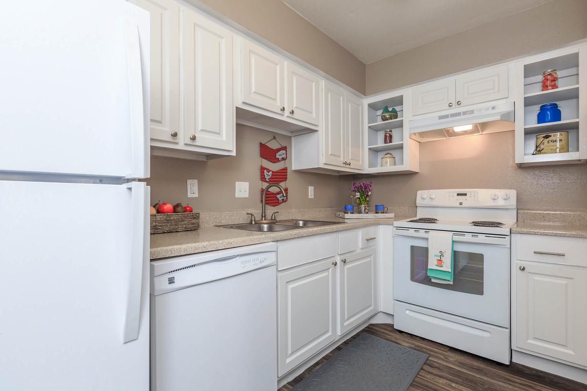 a white refrigerator freezer sitting inside of a kitchen