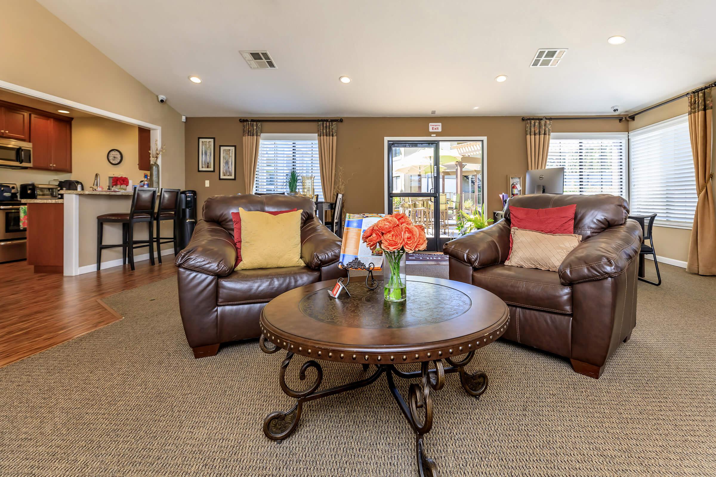 a living room filled with furniture and a flat screen tv