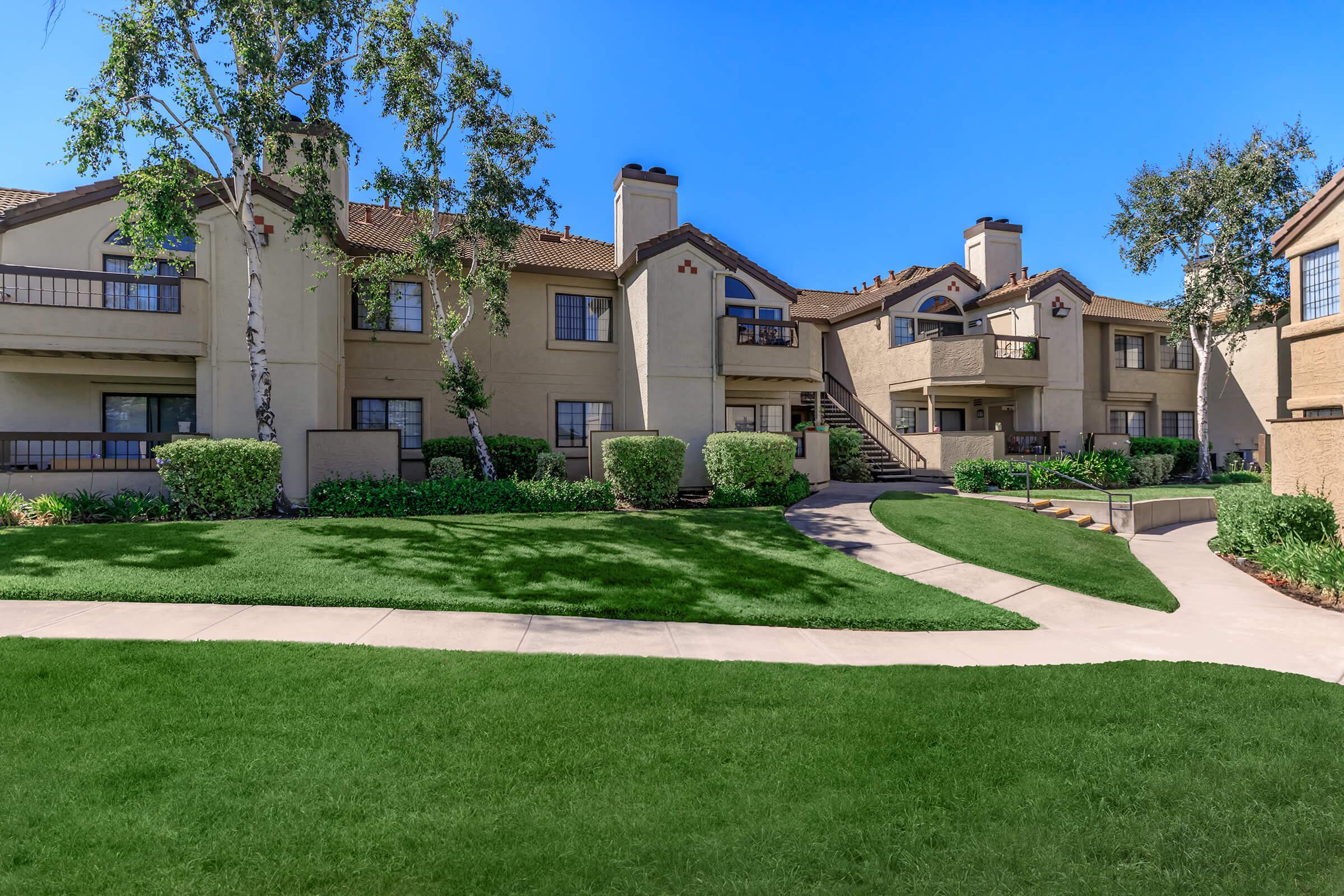 a large lawn in front of a house