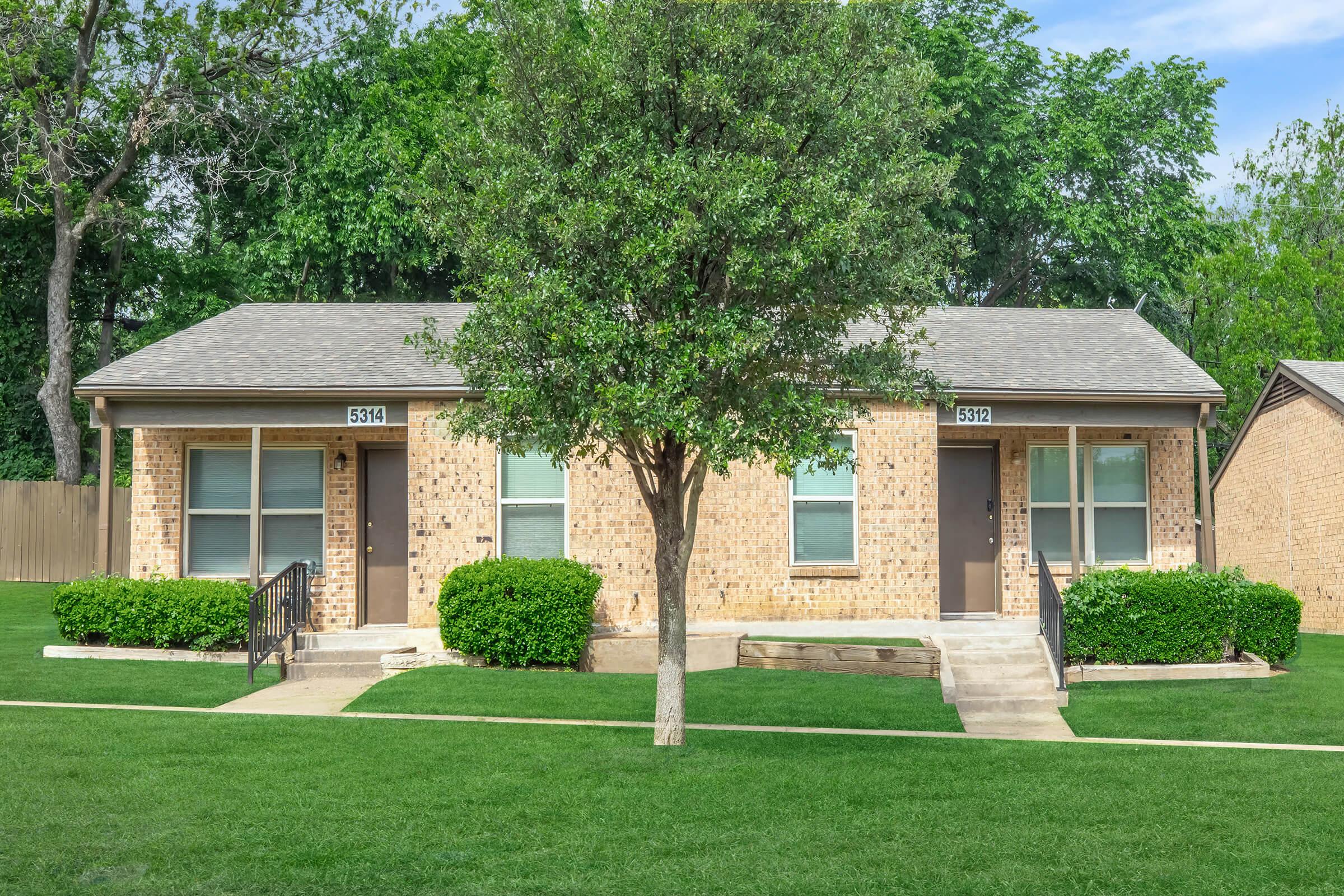 a large lawn in front of a house