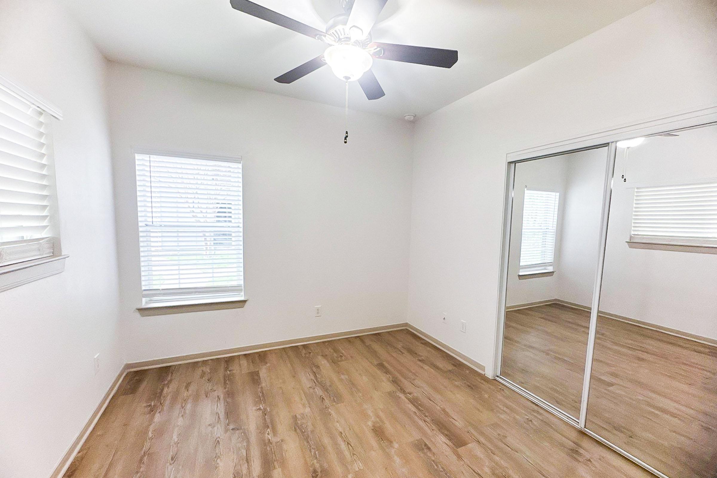 Bedroom with Ceiling fan and Sliding Closet Doors