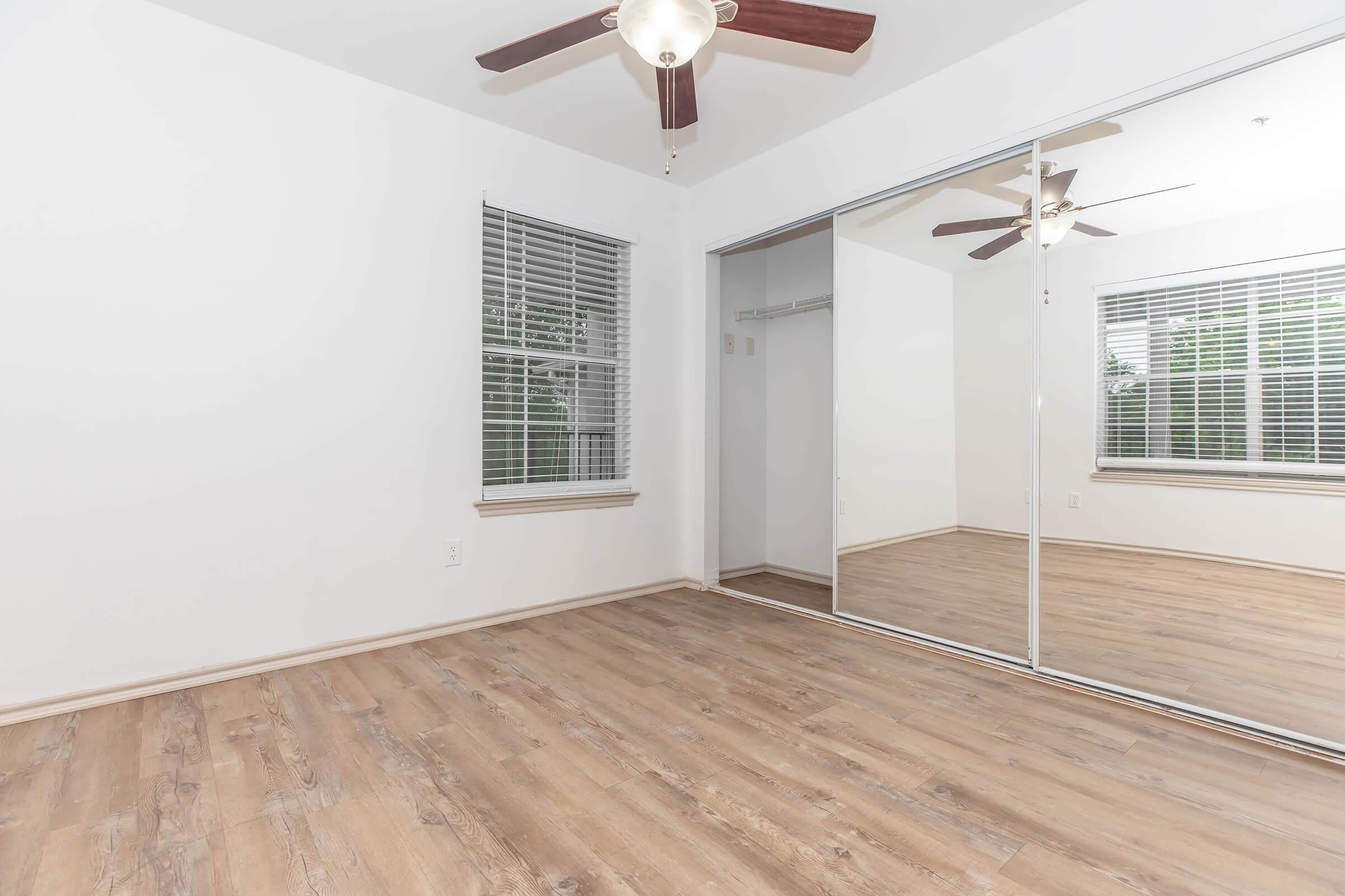 Large Bedroom with Mirrored Closet Doors