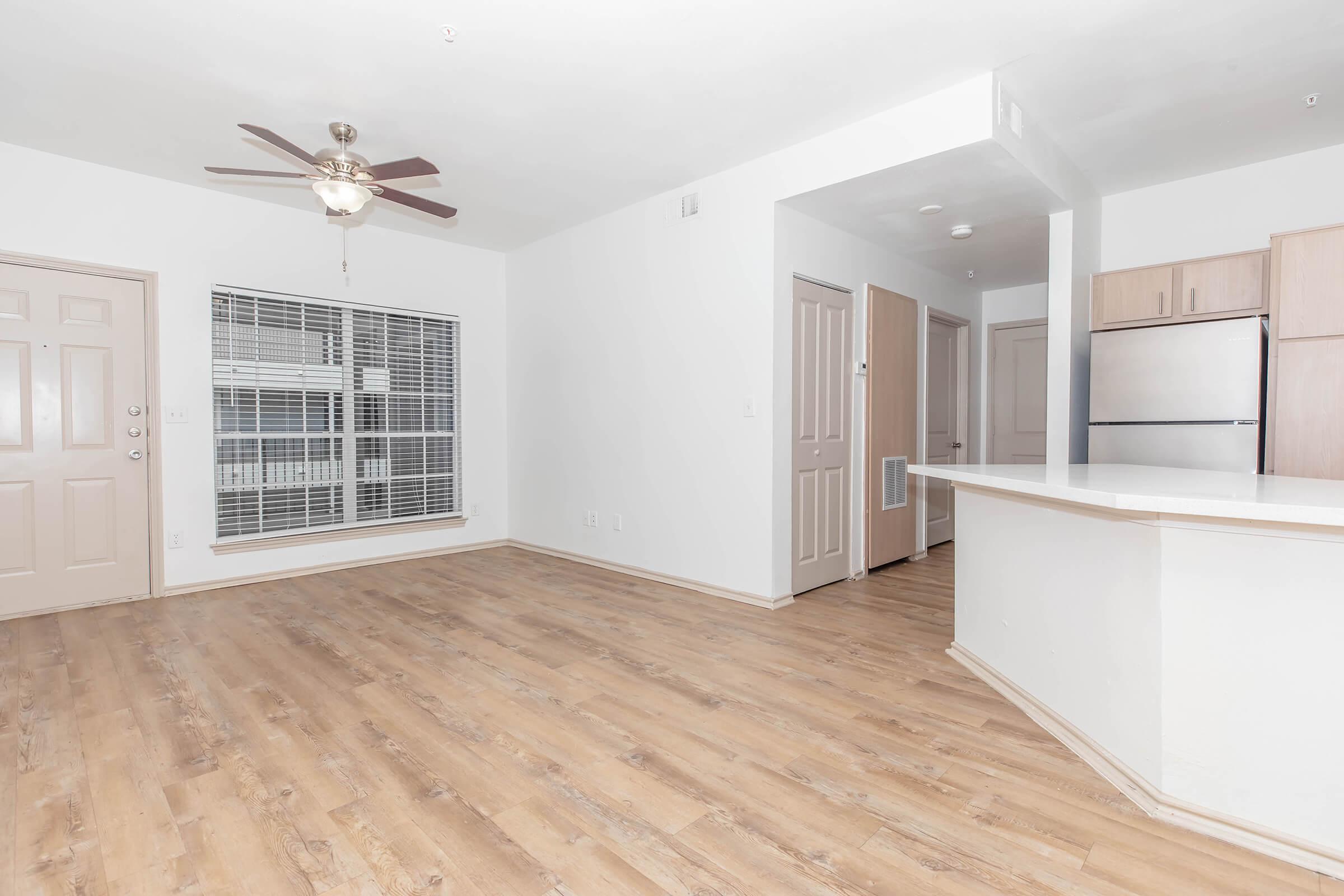 Wood-Style Flooring and Large Window in Living Room