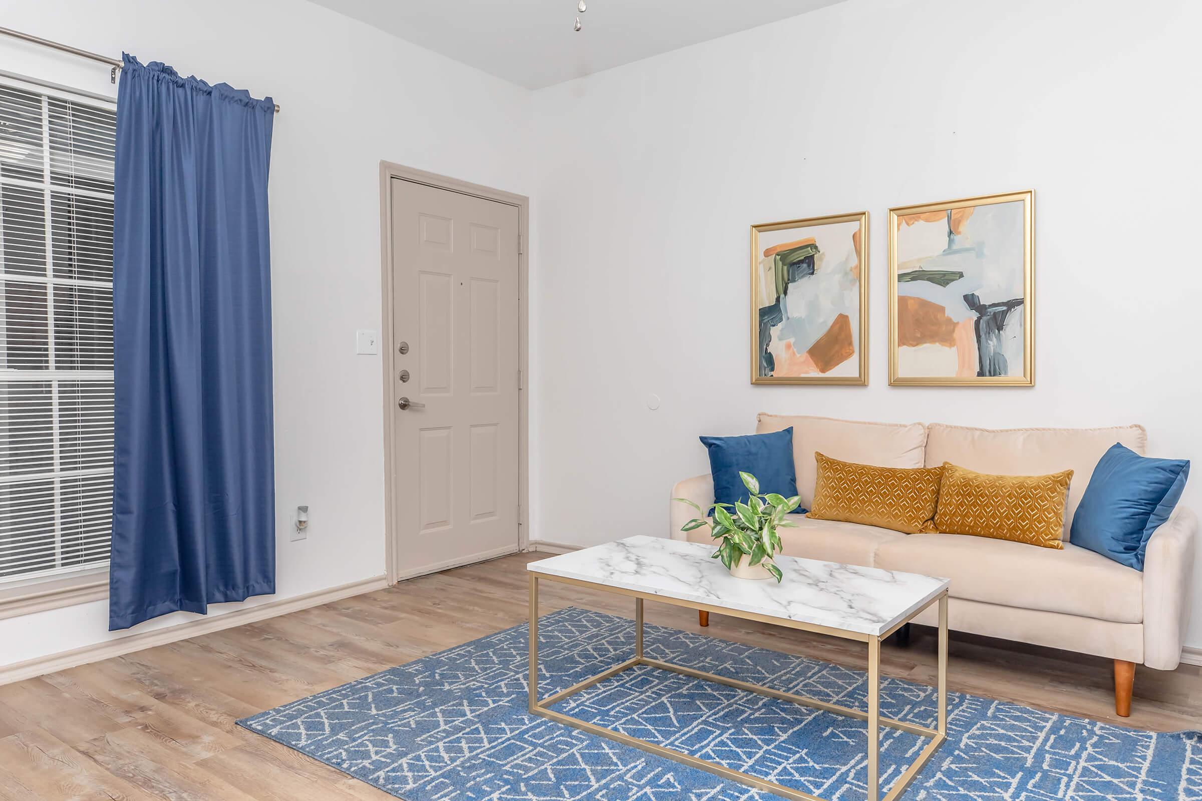 Come home to comfort and style—this cozy living area is the perfect spot to unwind after a long day, catch up with friends, or enjoy your favorite book with natural light streaming through the window.