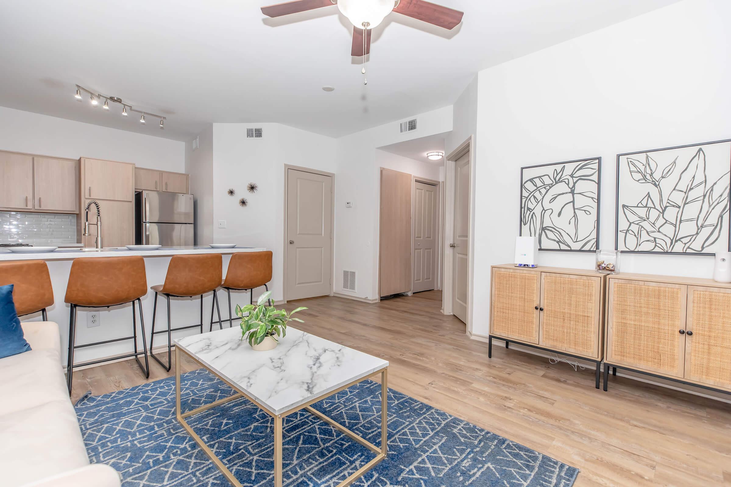 Settle into this bright, open-concept space—ideal for relaxing, entertaining, or sipping your morning coffee at the breakfast bar. It’s stylish, cozy, and built for everyday living.