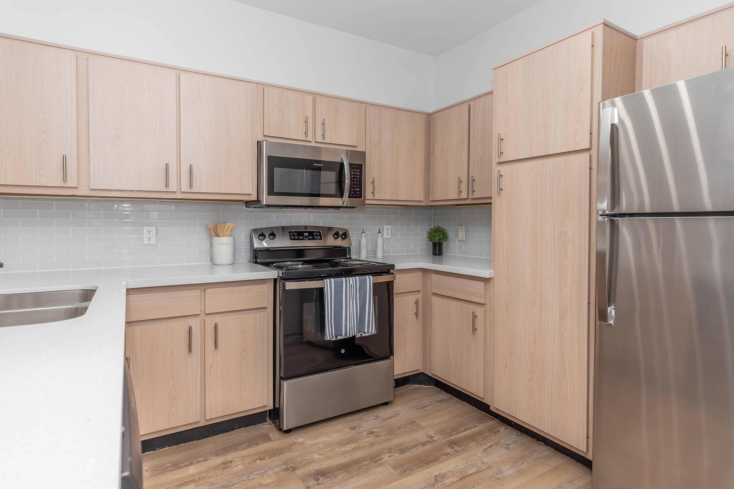 Cook in style with stainless steel appliances, quartz countertops, and ample cabinet space. Perfect for meal prep, morning coffee, or a cozy dinner—it’s a kitchen made for everyday ease.