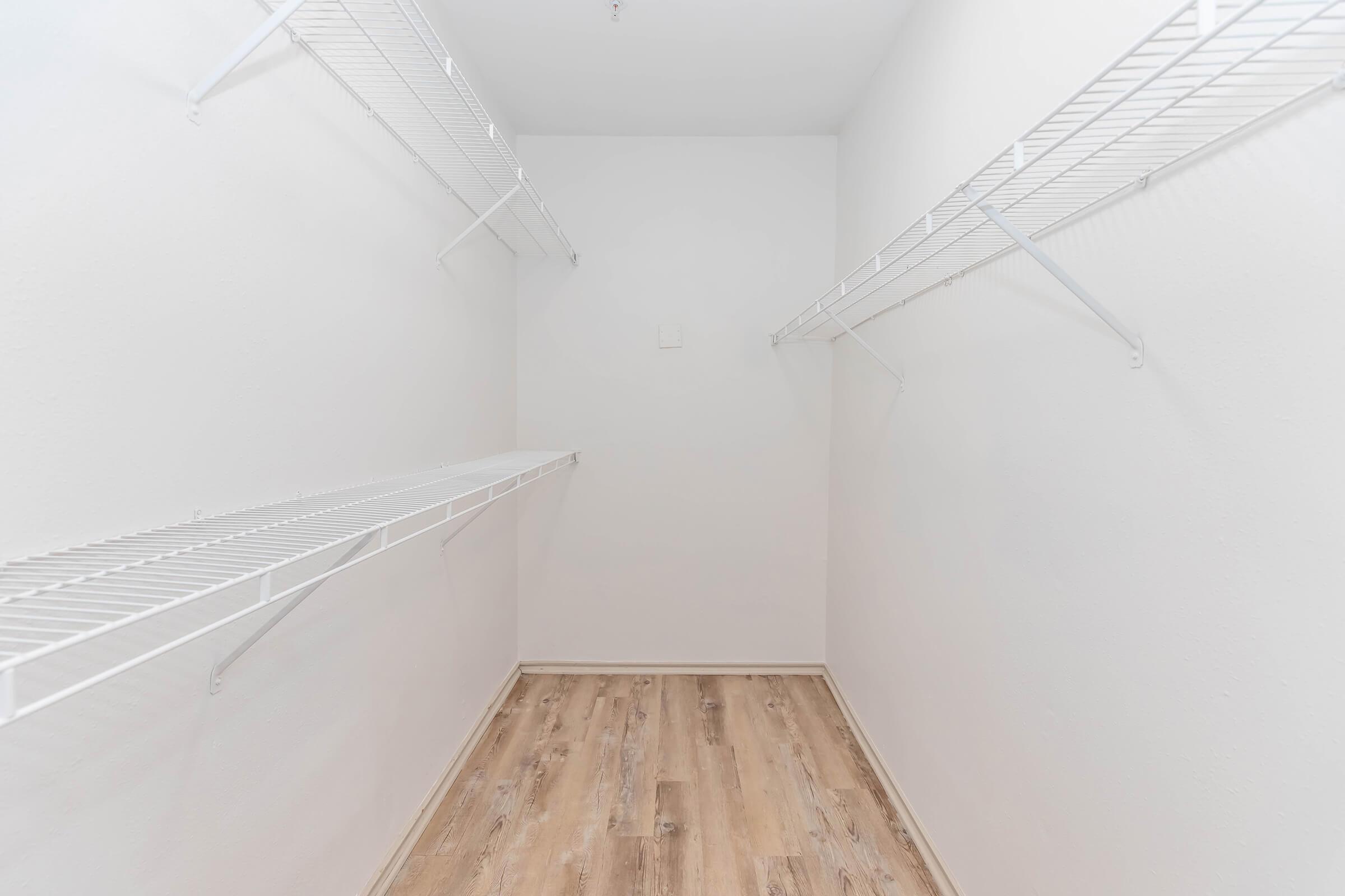 Say hello to storage goals! This spacious walk-in closet offers plenty of room for your wardrobe, shoes, and more—keeping everything organized and easy to find.