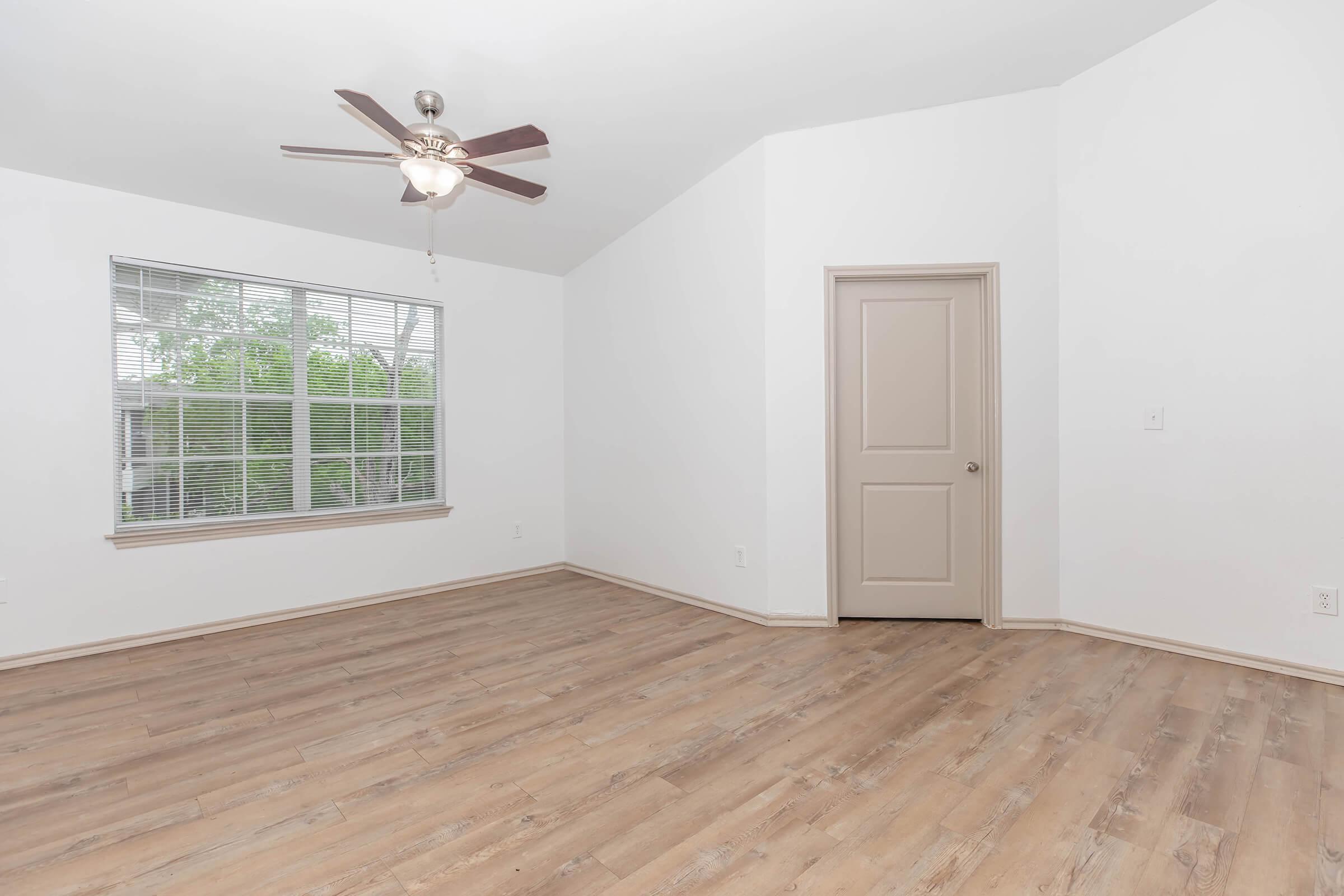 Spacious Living Room with Ceiling Fan