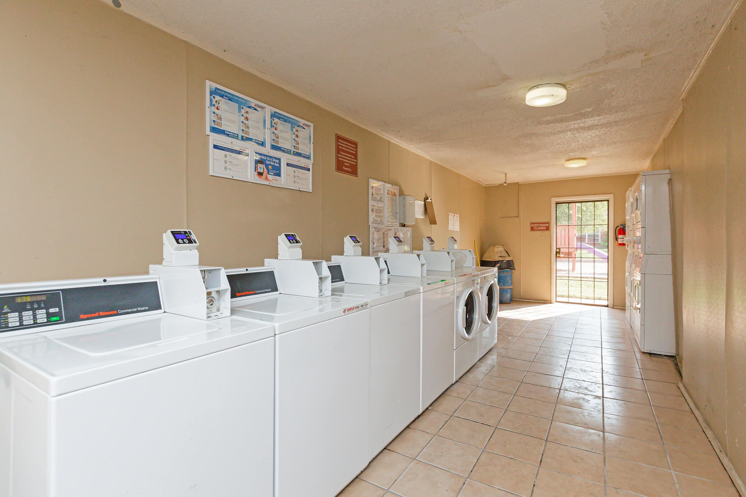 a kitchen with a sink and a refrigerator