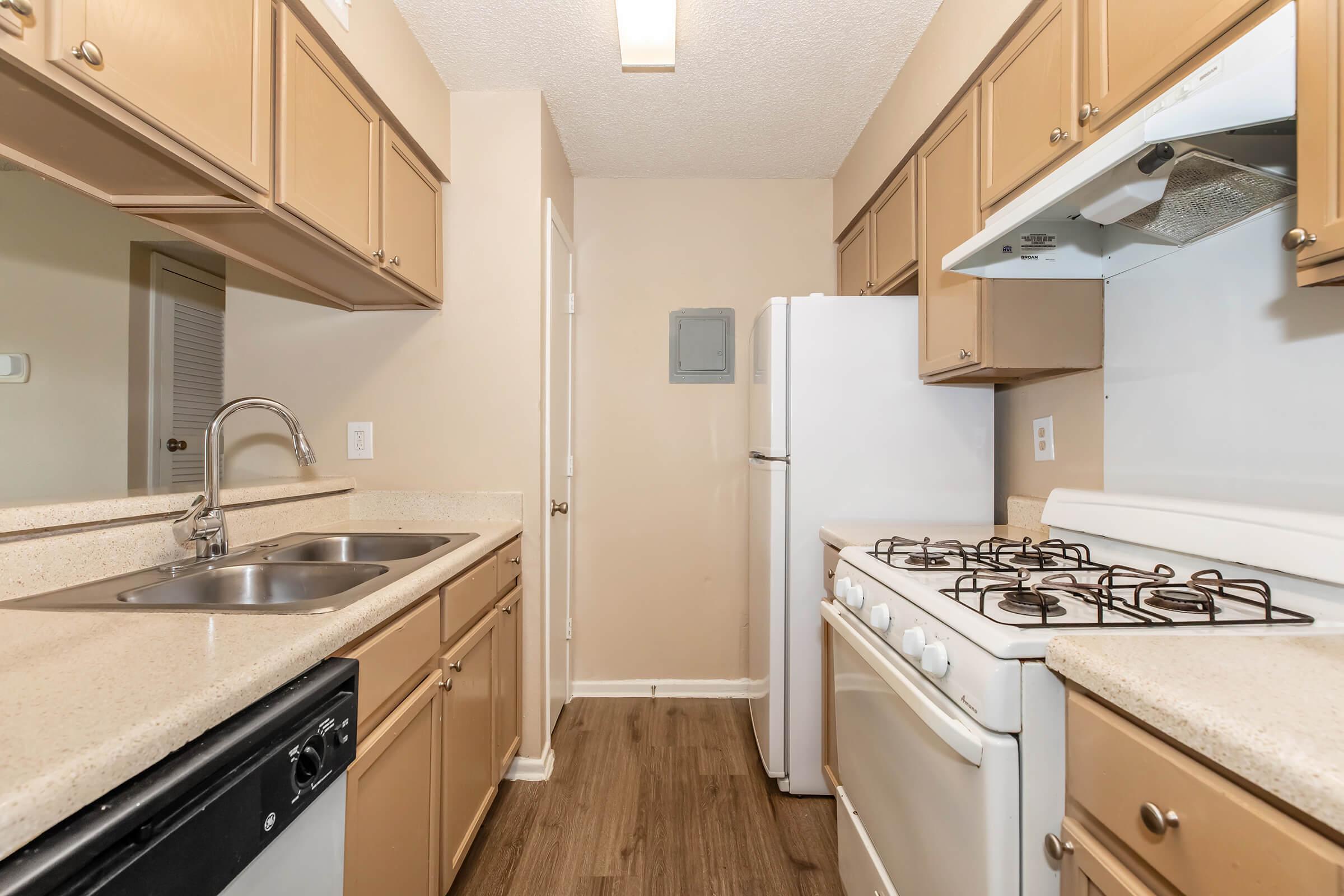 a kitchen with a stove and a sink