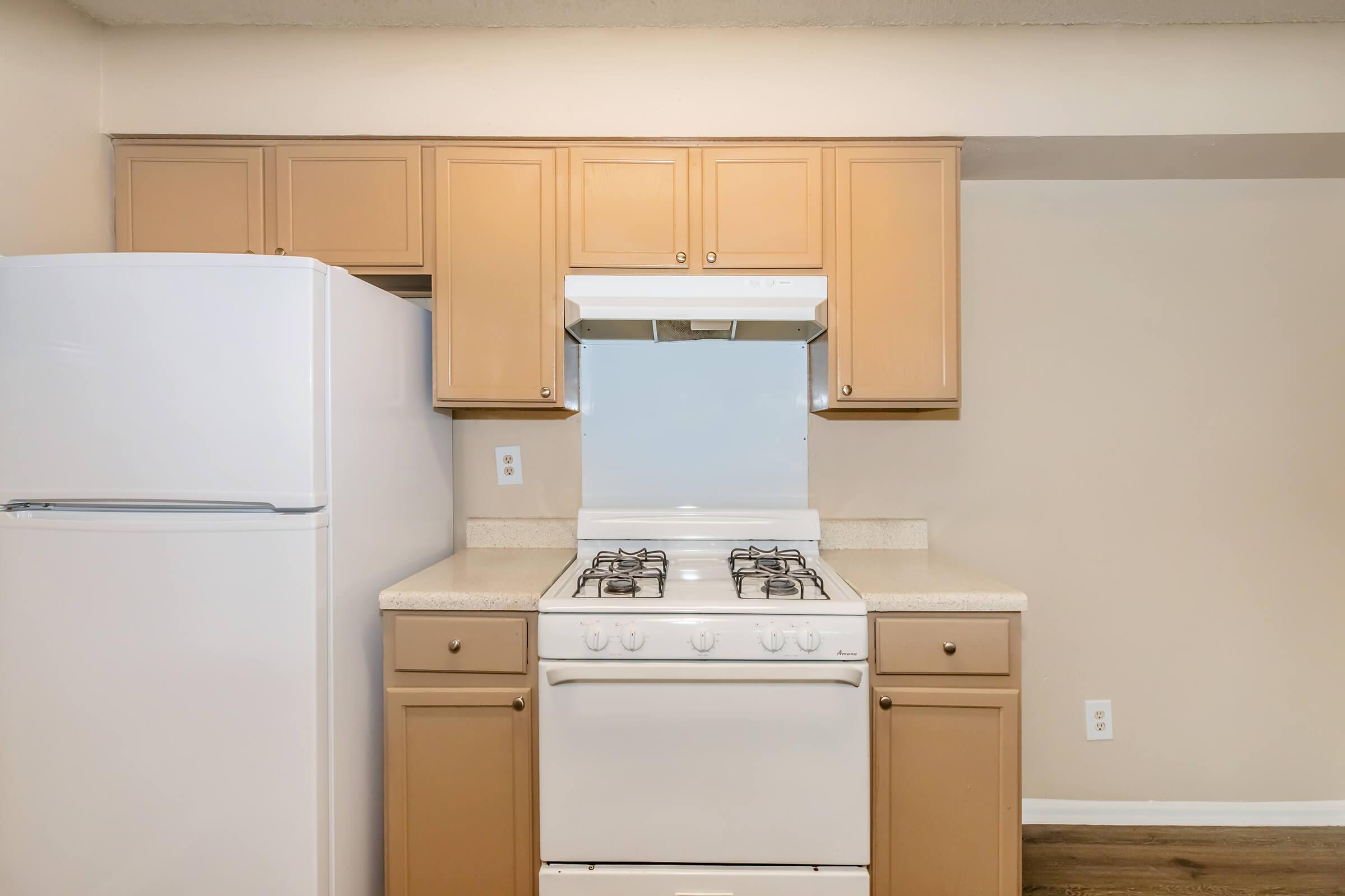 a kitchen with a stove top oven sitting inside of a refrigerator