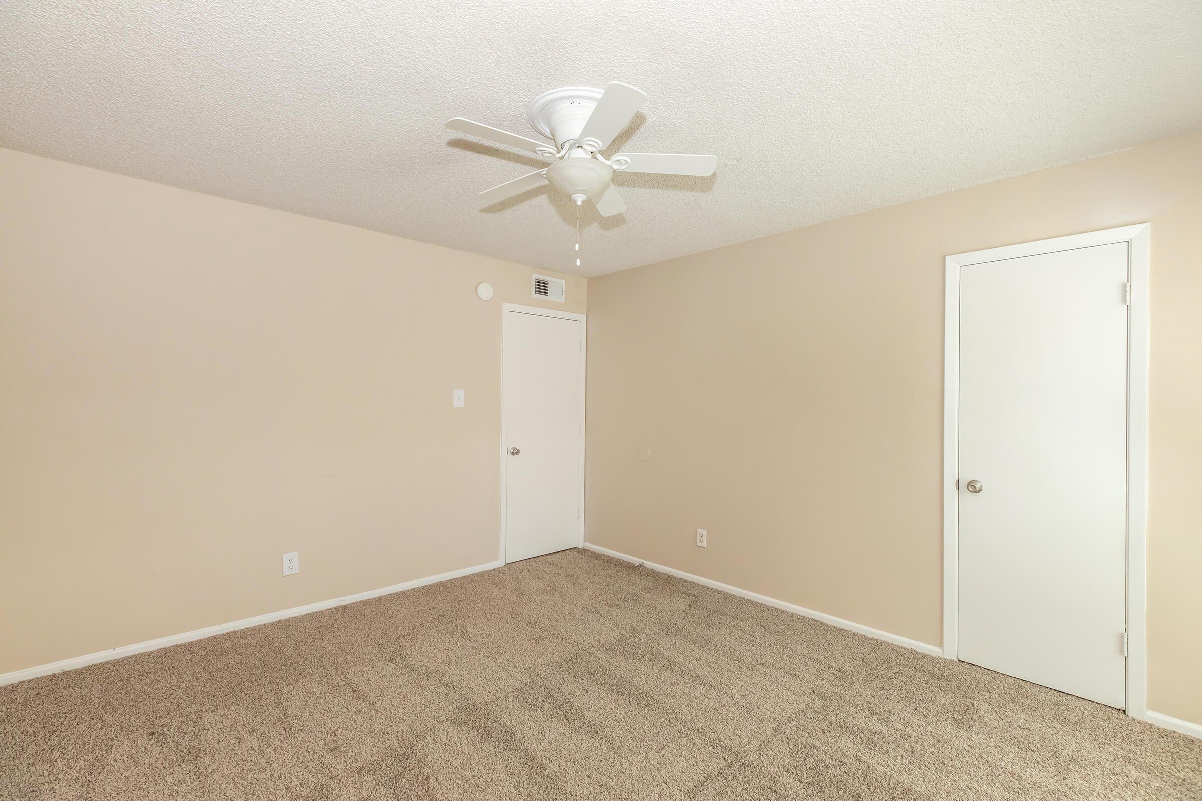 a bedroom with a large mirror