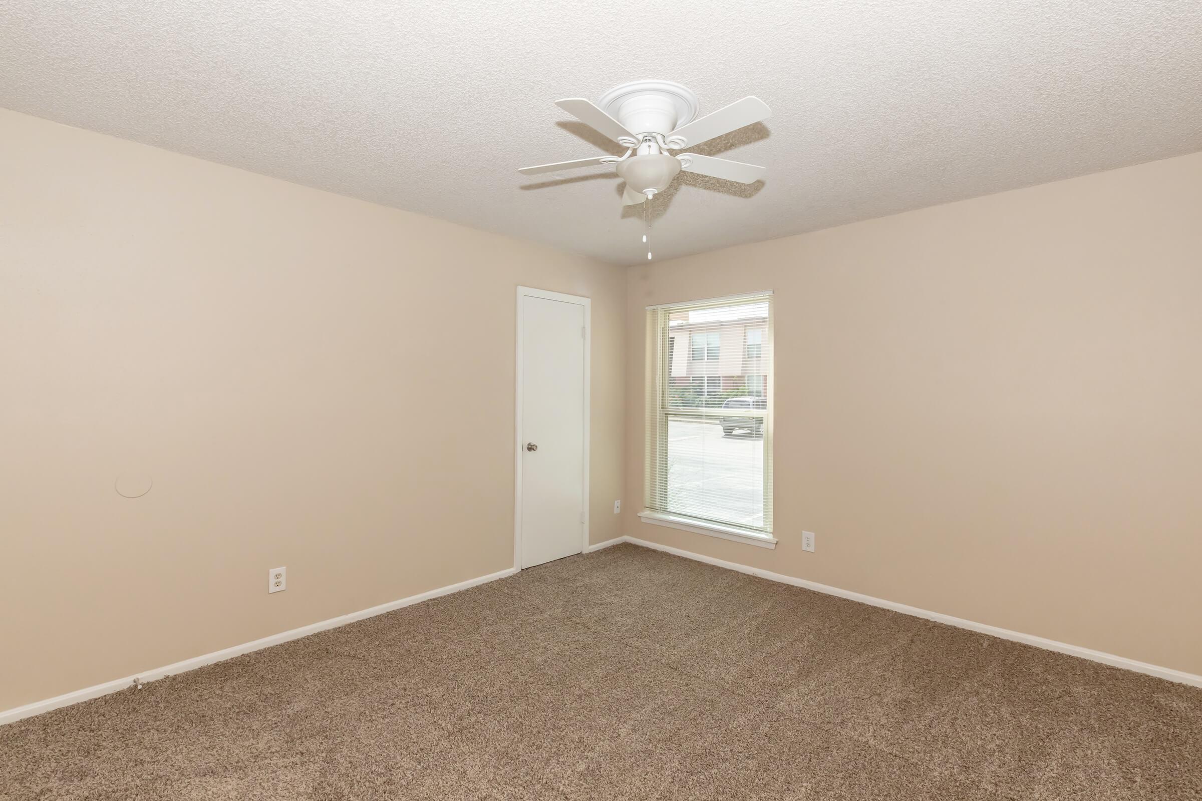 a bedroom with a large mirror