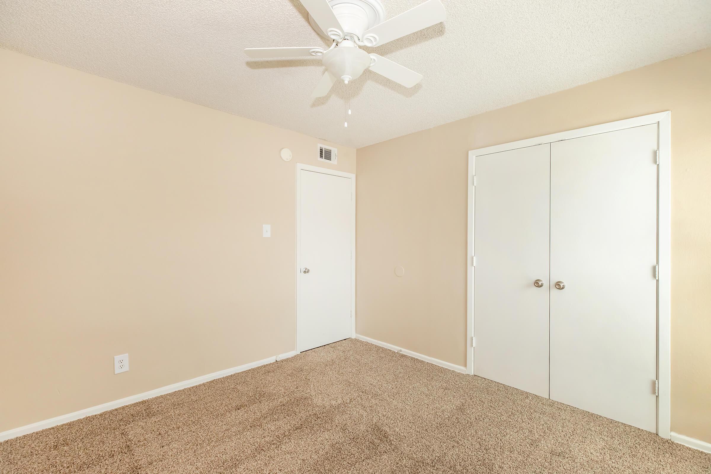 a bedroom with a large mirror