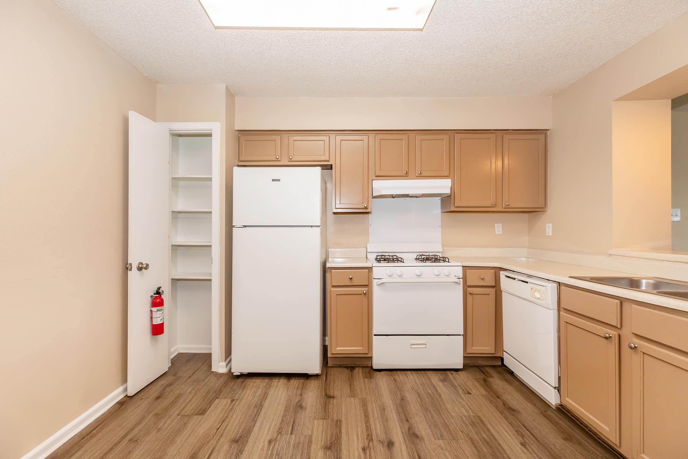 a kitchen with a wood floor