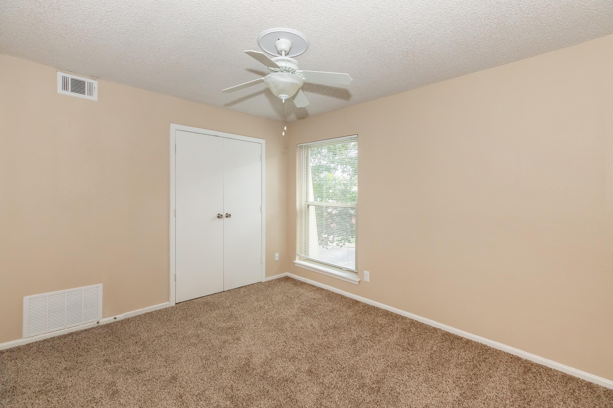 a bedroom with a large mirror