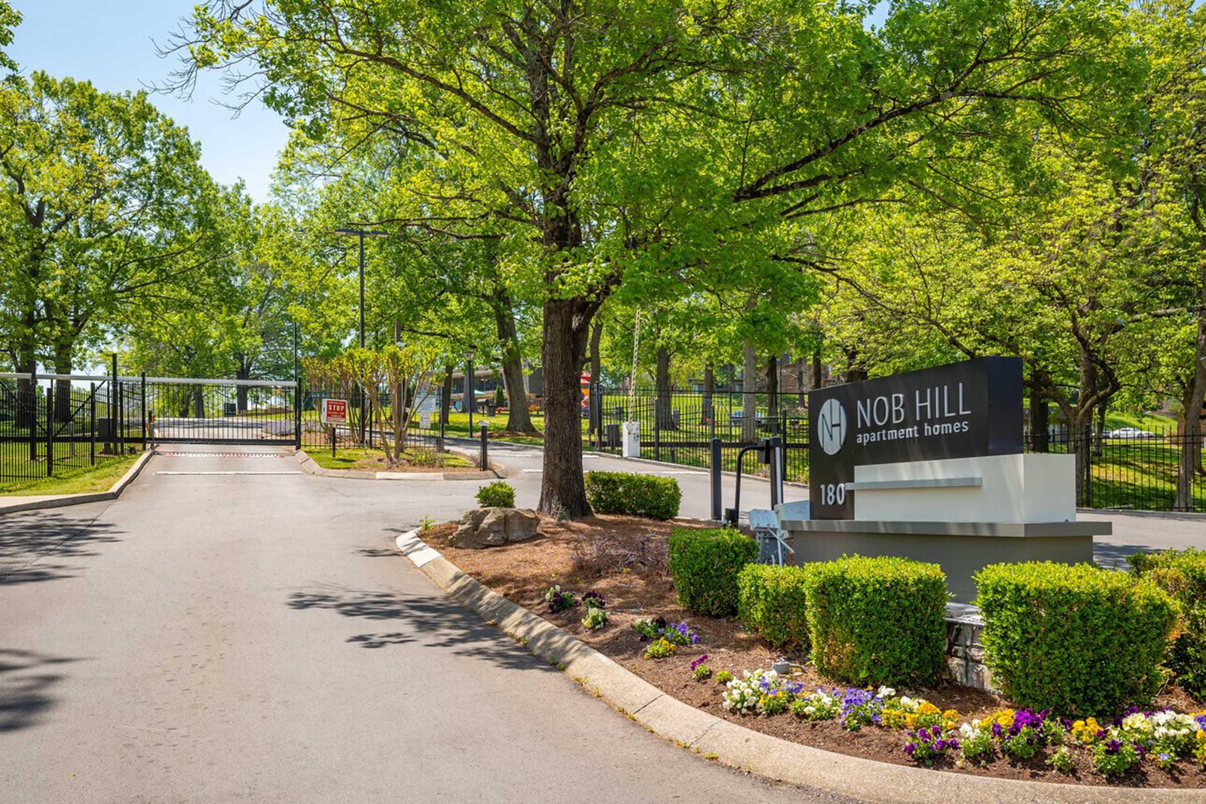 Beautifully landscaped entrance to Nob Hill Apartments located in Nashville, Tennessee.