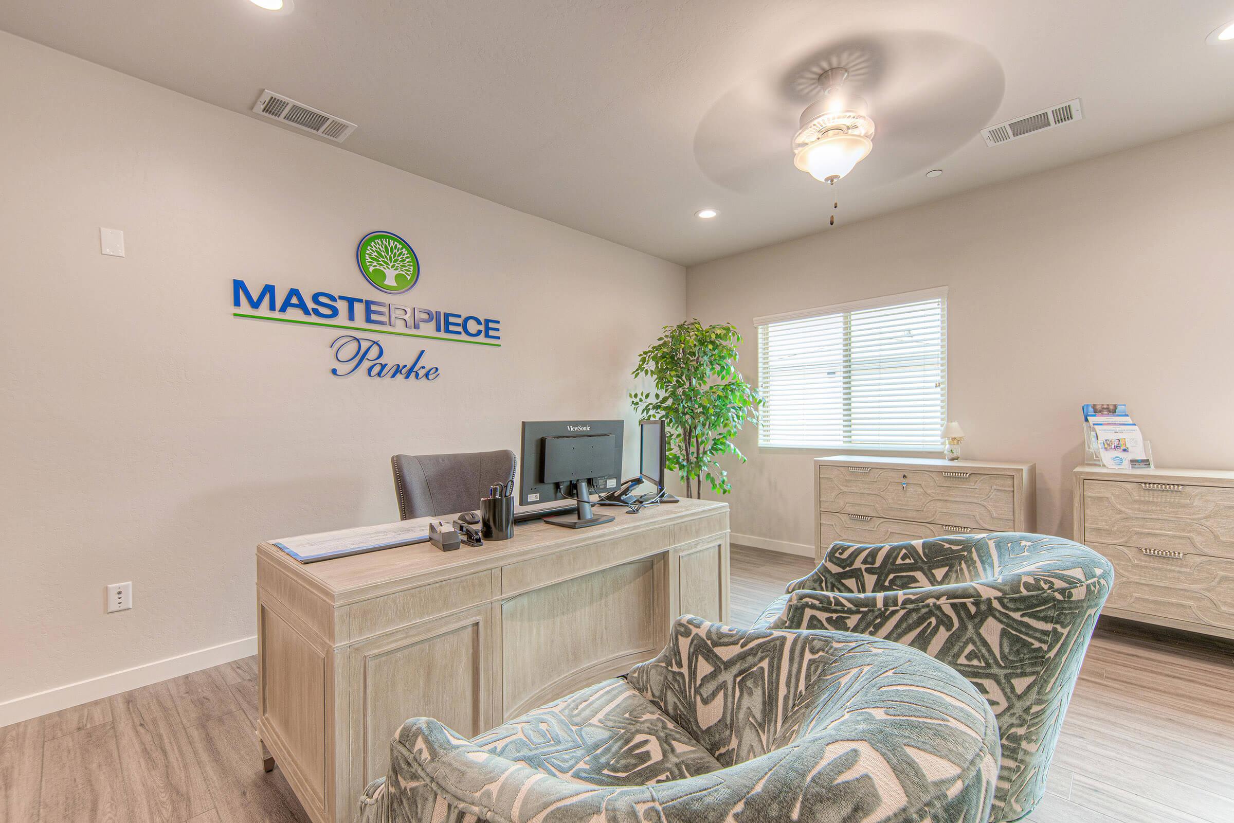 Masterpiece Parke leasing office with green chairs