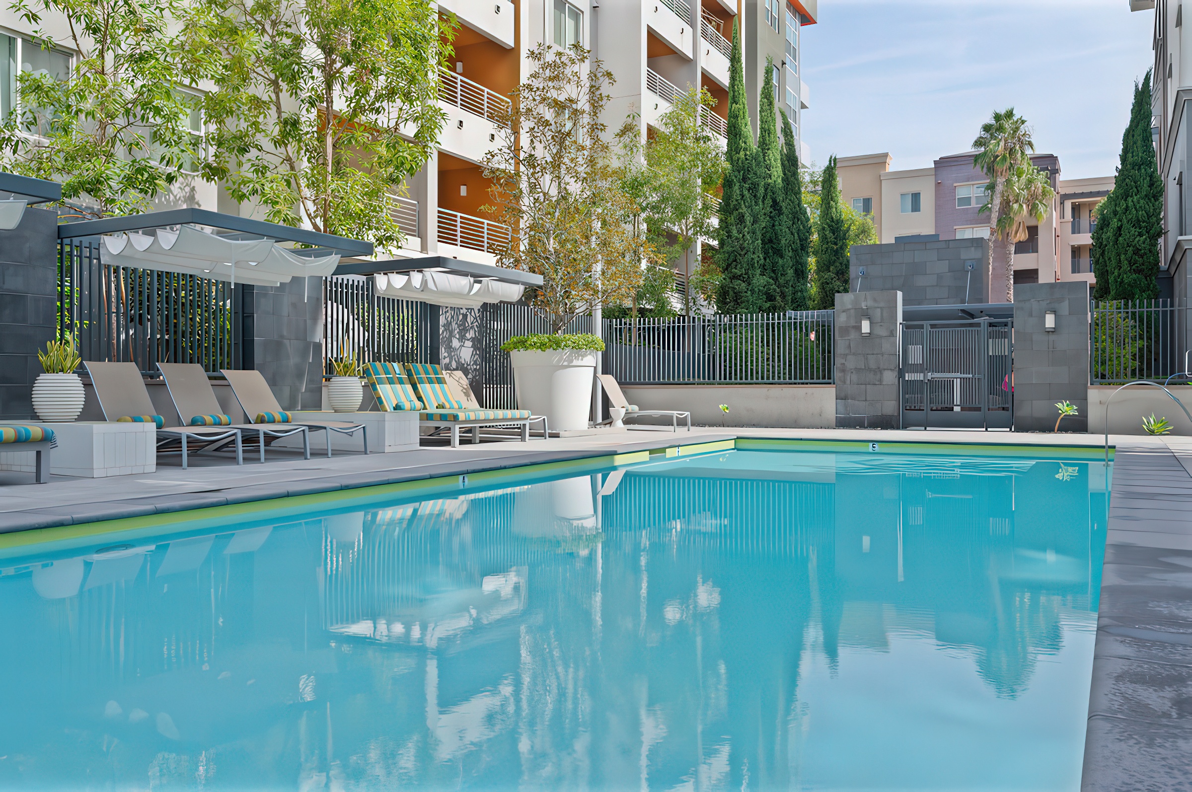 view of swimming pool with building in background